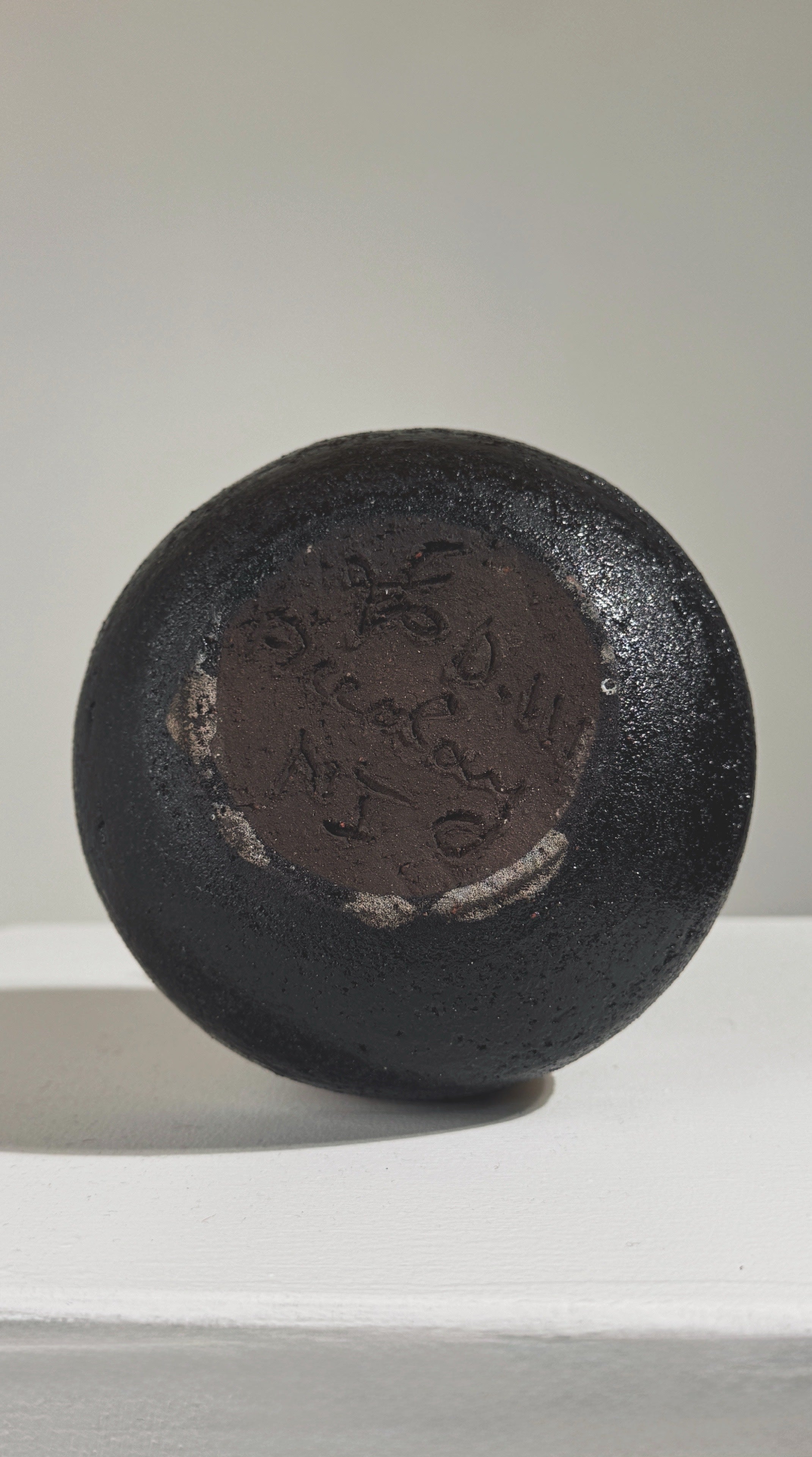 Bottom view showing maker's mark on vintage Accolay stoneware pitcher
