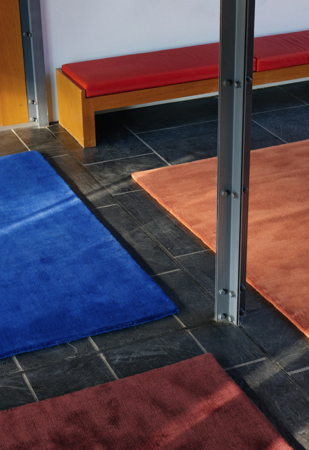 'Solid Wool' Handwoven Rug, Ruby Red — lifestyle setting
