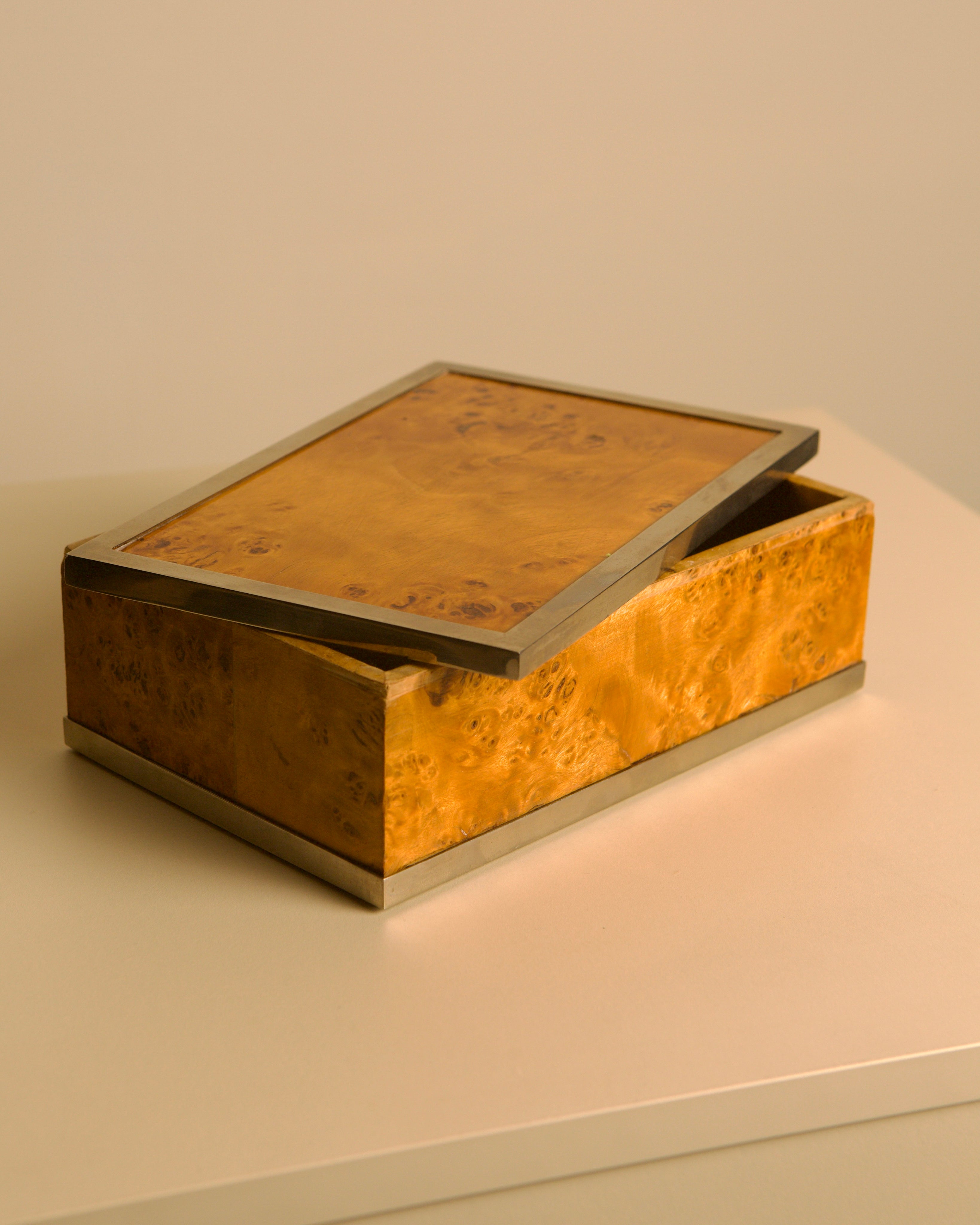 Italian 1970s poplar burl wood and metal smoking desk set — top view of burl wood box with metal trim