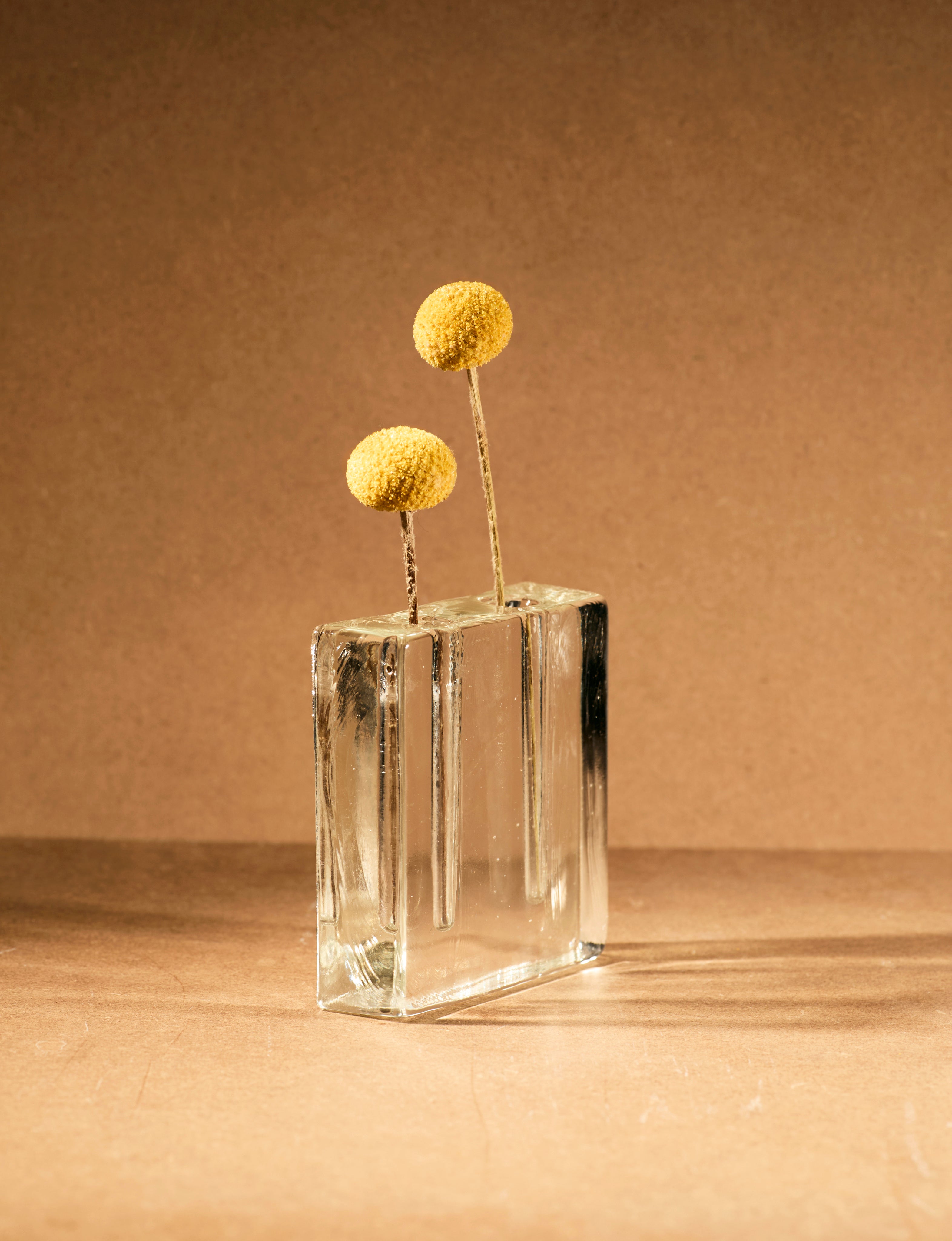 Vintage Scandinavian Clear Vase in Glass c. 1960 — close-up with yellow flowers in glass