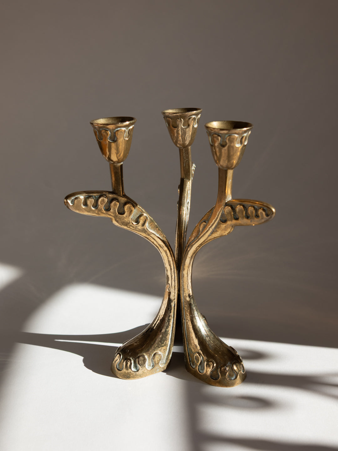 Brass Secessionist Three-Arm Candelabra - Austria, c. 1930s — close-up of intricate brass design