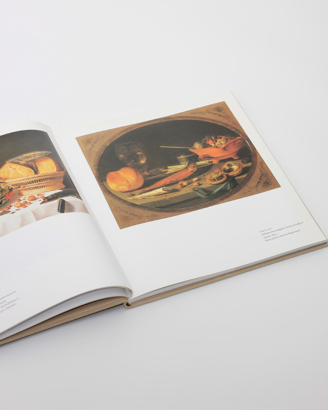 PIETER CLAESZ — side angle of open book on white surface