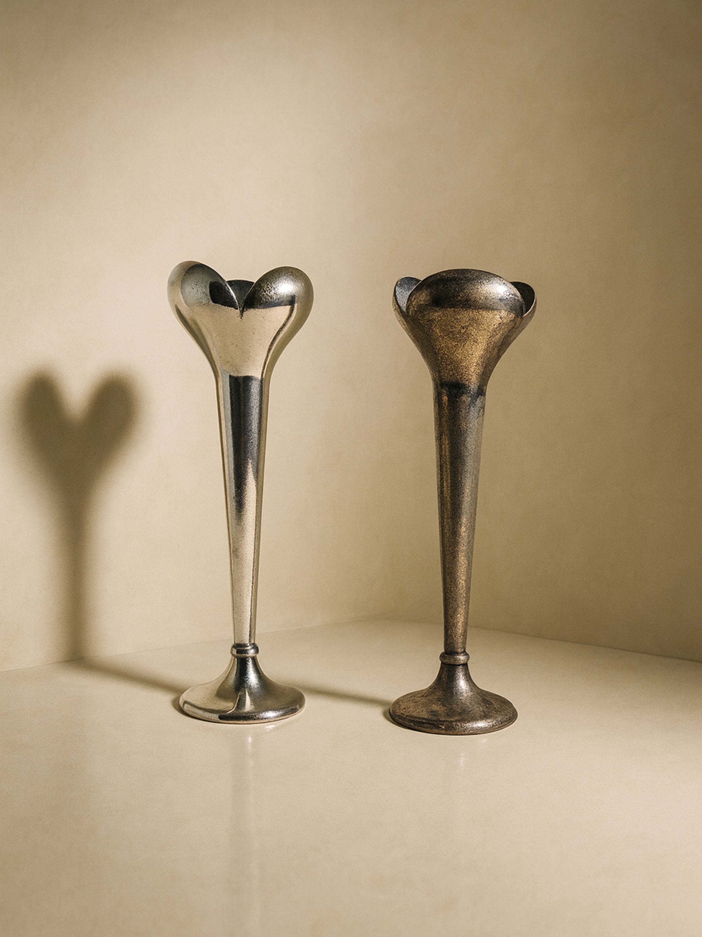 Set of 2 Candlesticks - Gio Ponti for Calderoni - 1930s — side angle showing polished metal and patina finish