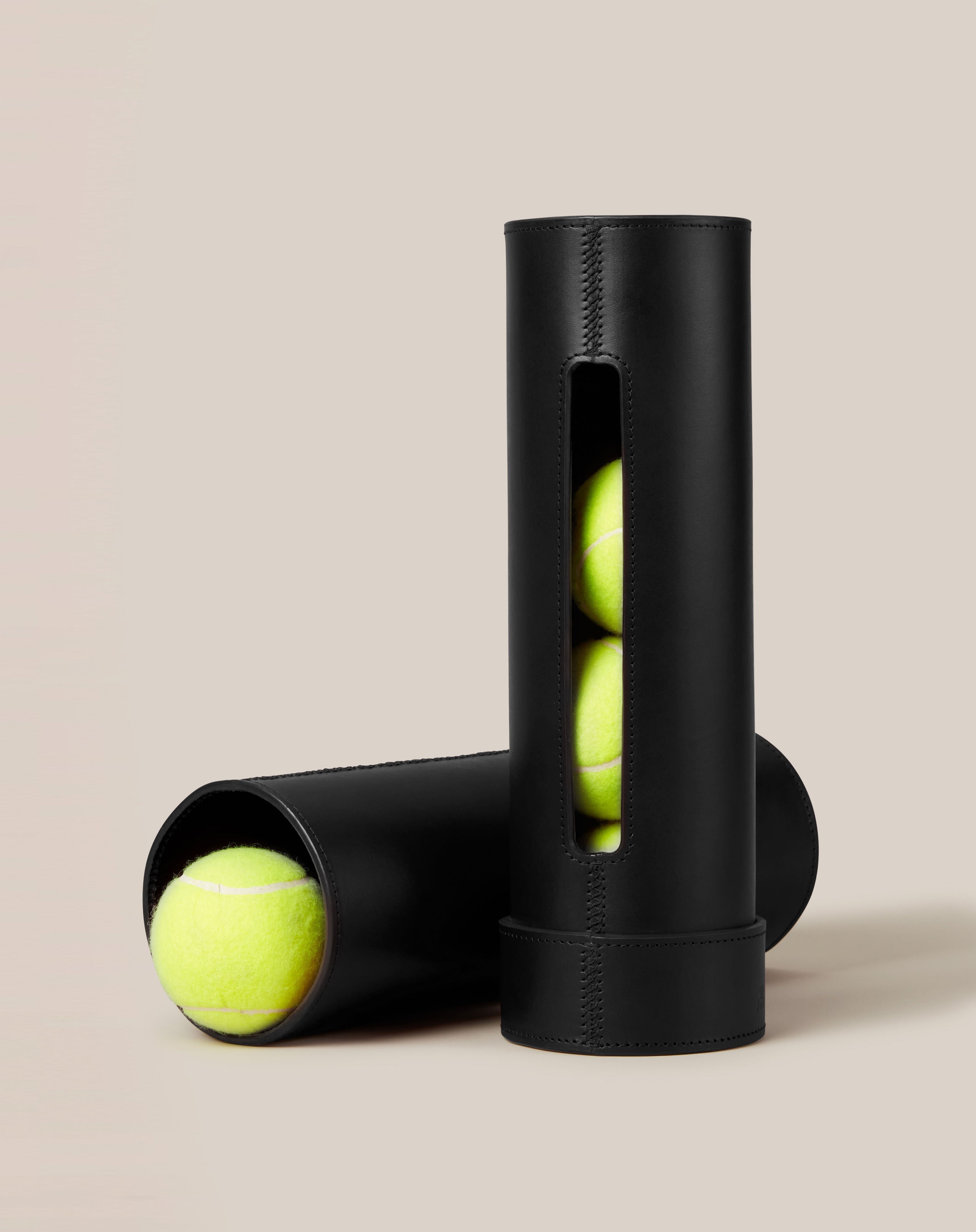 Leather Tennis Ball Holder — top view showing black leather with tennis balls