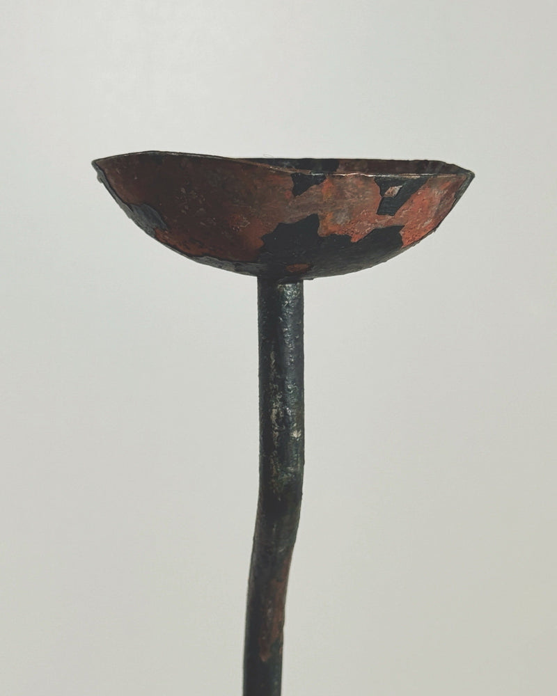 Large wrought iron candleholder with sculptural bowl and long stem