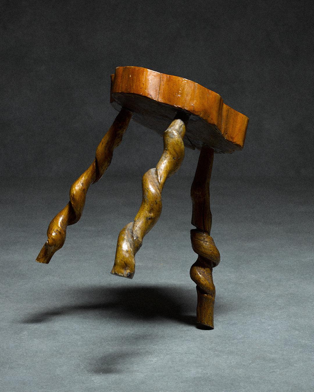 Small Tripod Stool — angled view of twisted wooden legs