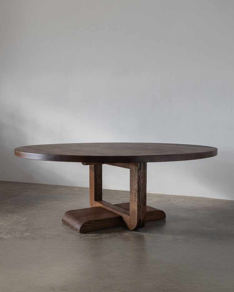 Alpen Round Dining Table — close-up of dark wood base and round top