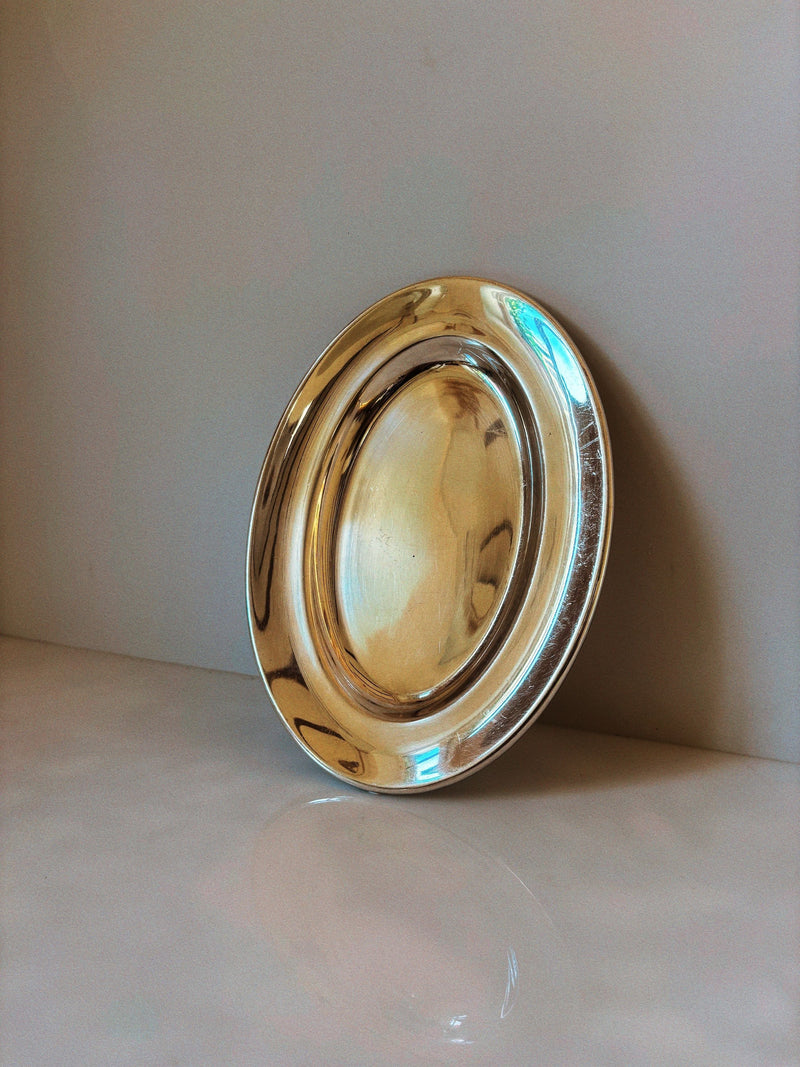 Silver plated oval serving platter with polished reflective finish