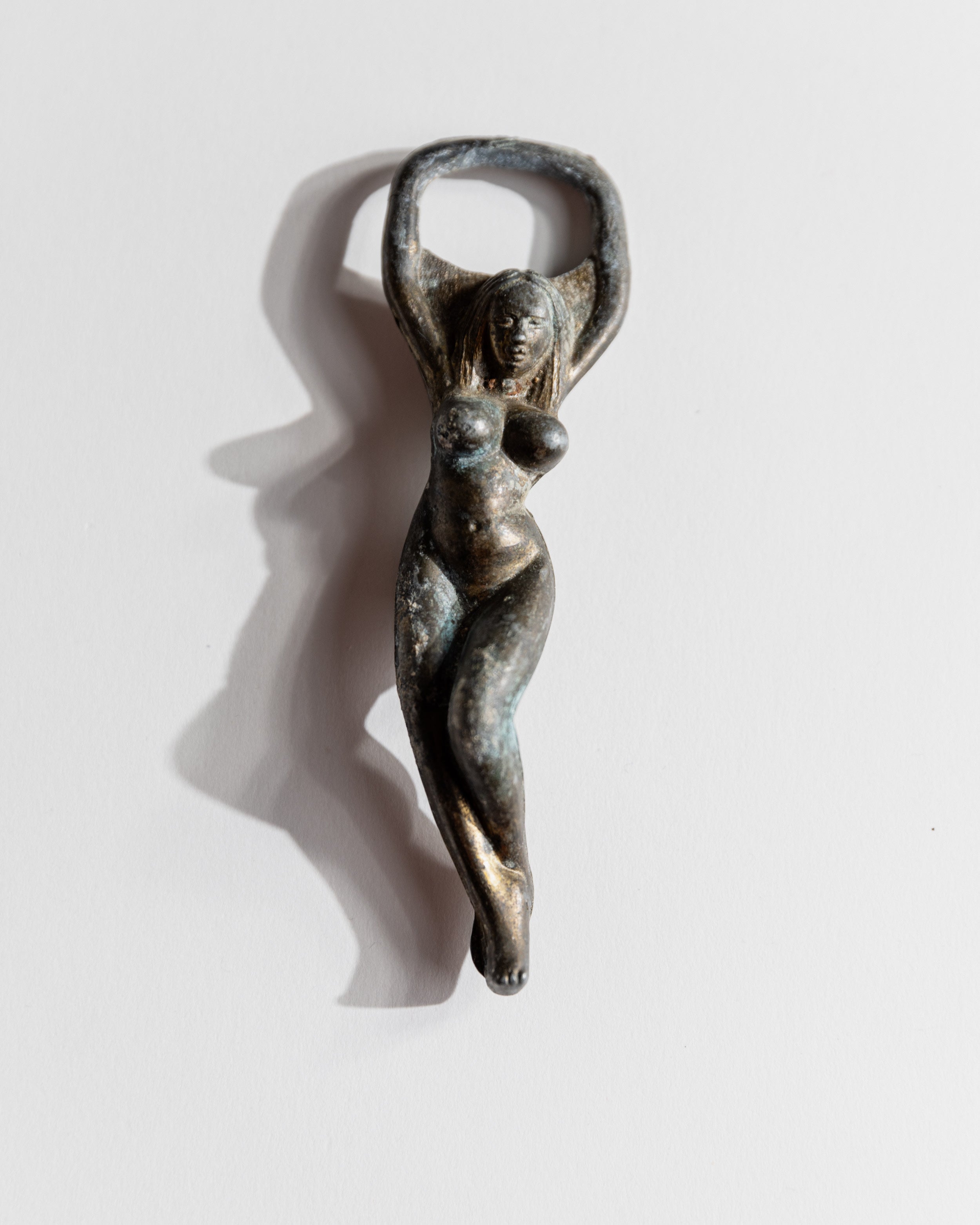 Vintage 1940s Bottle Opener Brass, Nude Woman Shape — top view showing detailed figure design