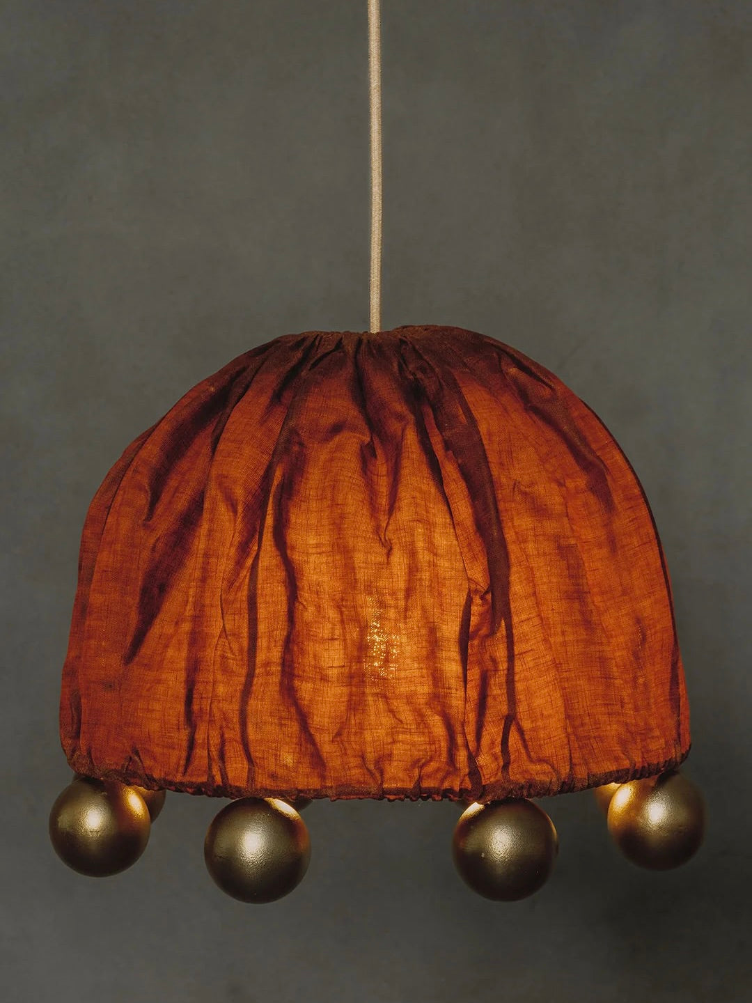 ALTER Pendant Light | Brass Beeswax Linen Ceriops — overhead view in warm-toned setting