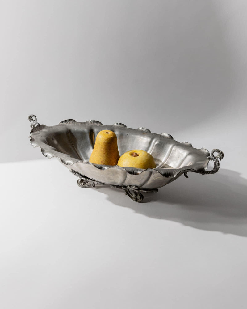 1940s Pewter Centerpiece Bowl — angled view with two yellow pears inside