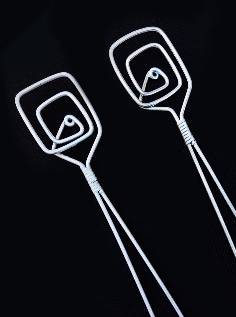 80's Salad Servers — close-up of white metal spiral design