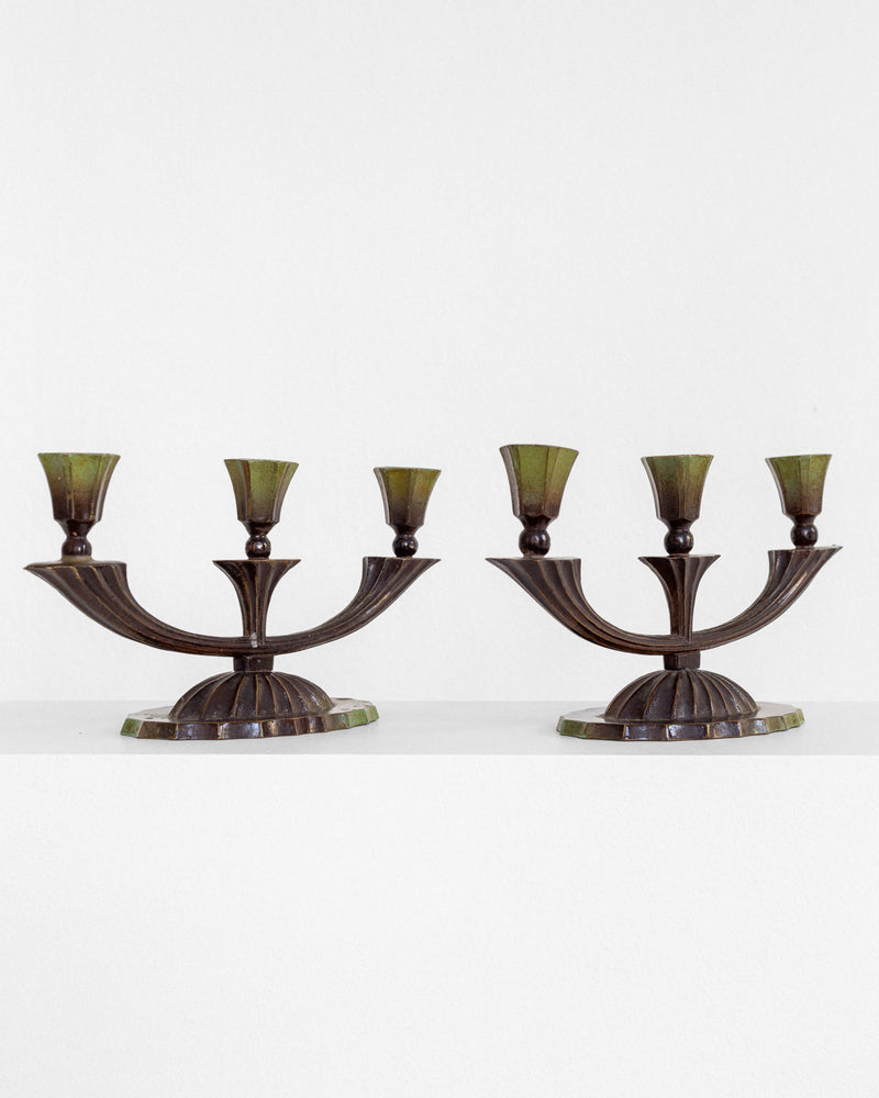 Pair of Art Deco bronze three-arm candelabras with green shades