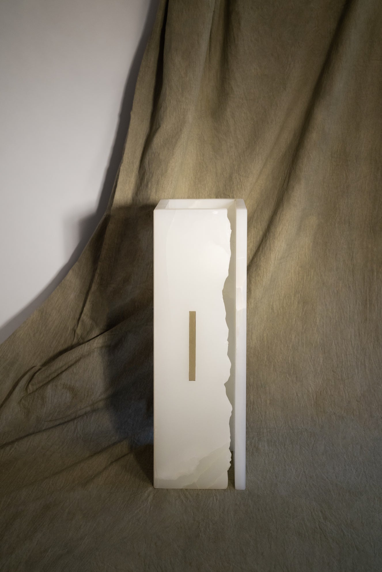 03C PURE WHITE ONIX Collectible Lighting in stone — top view highlighting onyx texture and brass detail