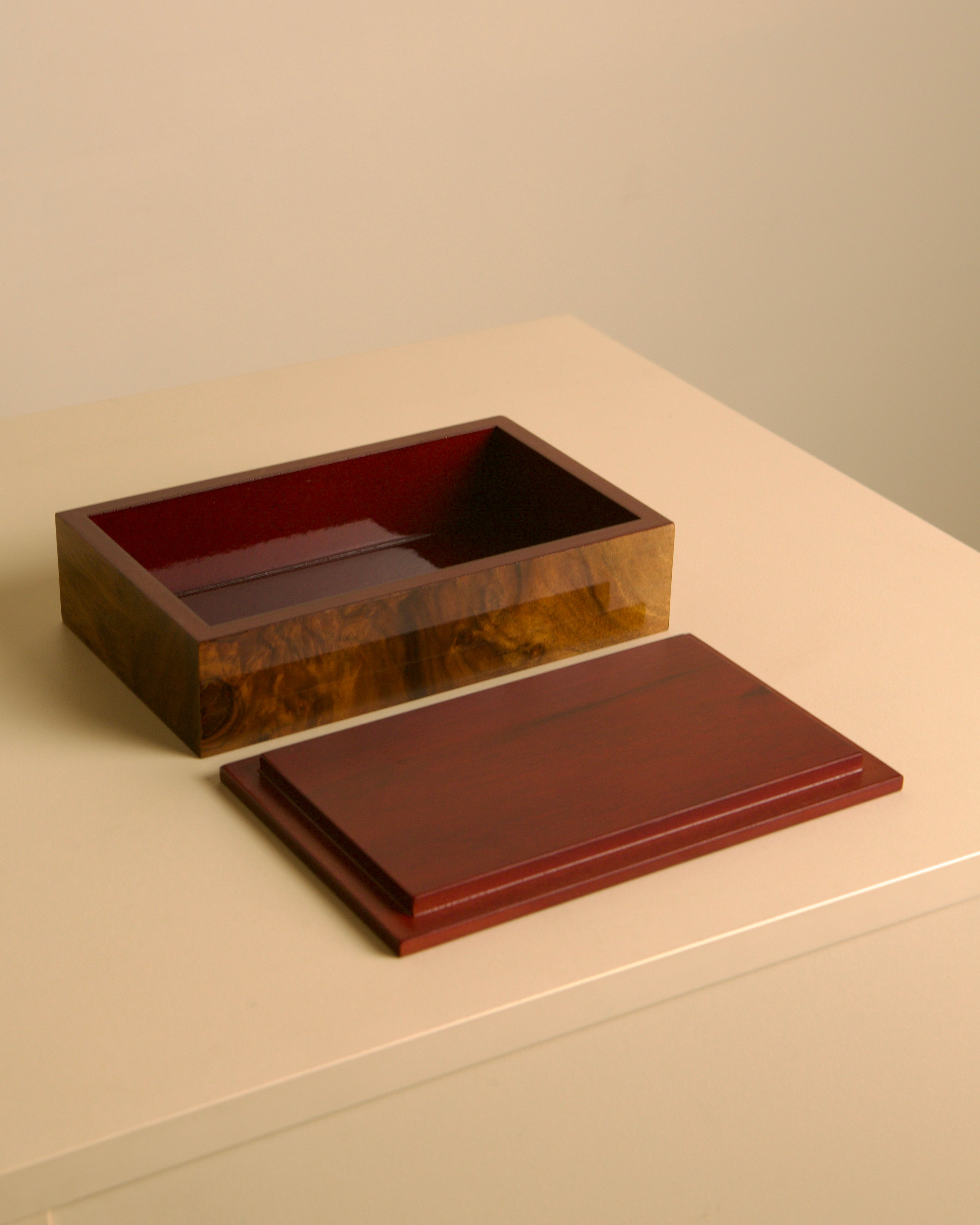 Italian burr walnut box with red interior 80s — angled view on neutral surface