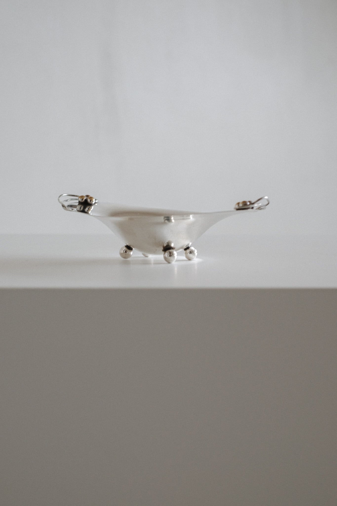 Small Silverplated Bowl — side angle on white surface