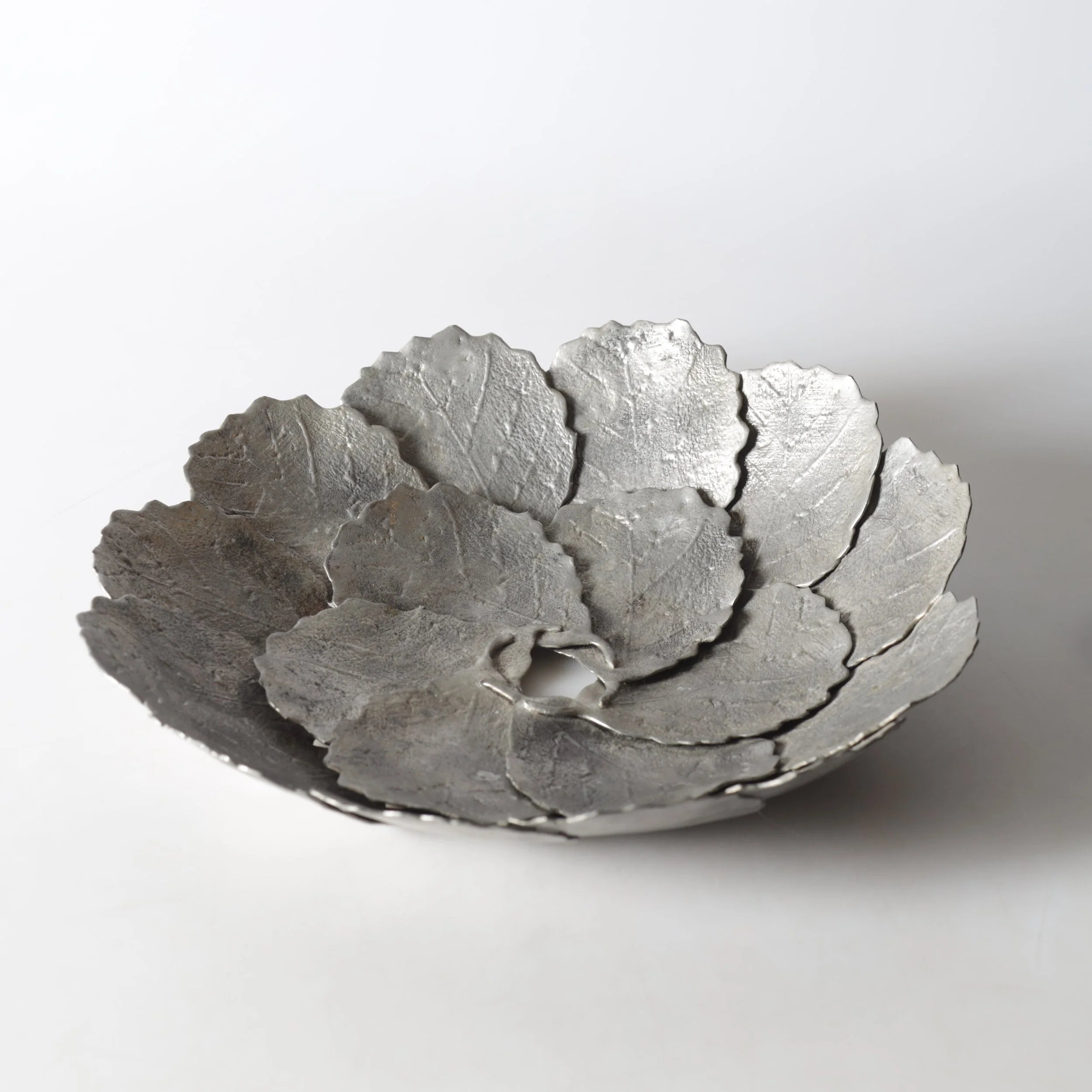 A large decorative 'Höstlöv' pewter dish, (1973) — side angle