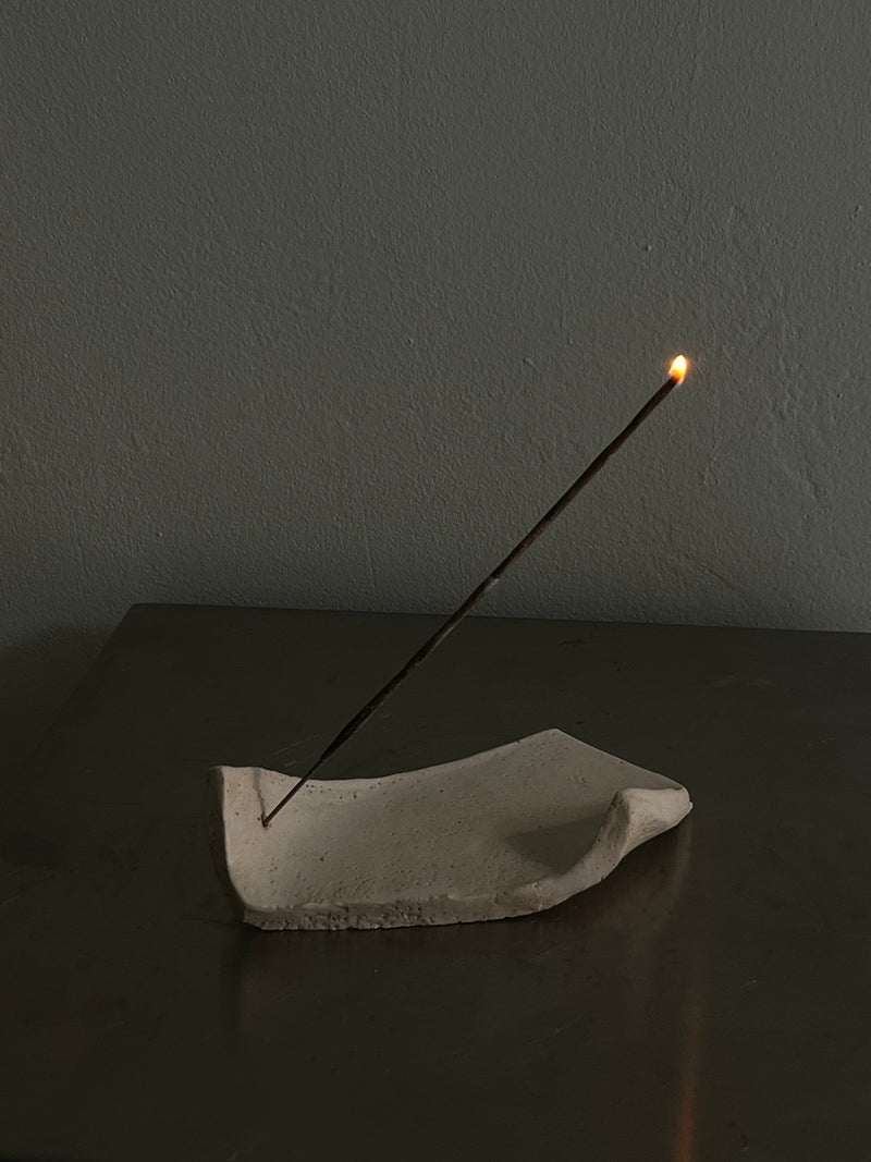 Minimalist concrete incense holder with burning stick by 2222Studio