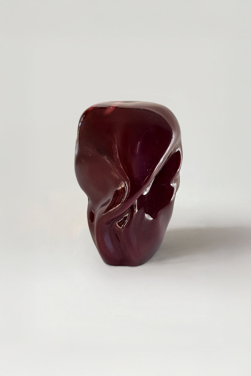Wave Stool / Side Table VI — close-up of deep red resin surface