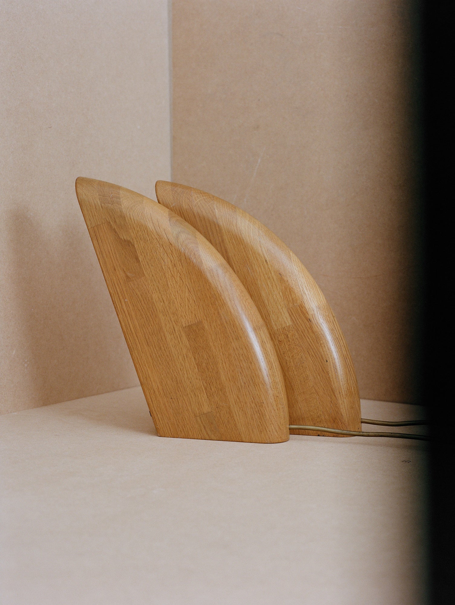 Set of 2 Vintage French Artisanal Table Lamps in Solid Oak Wood C. 1980 — side angle showing curved oak bases