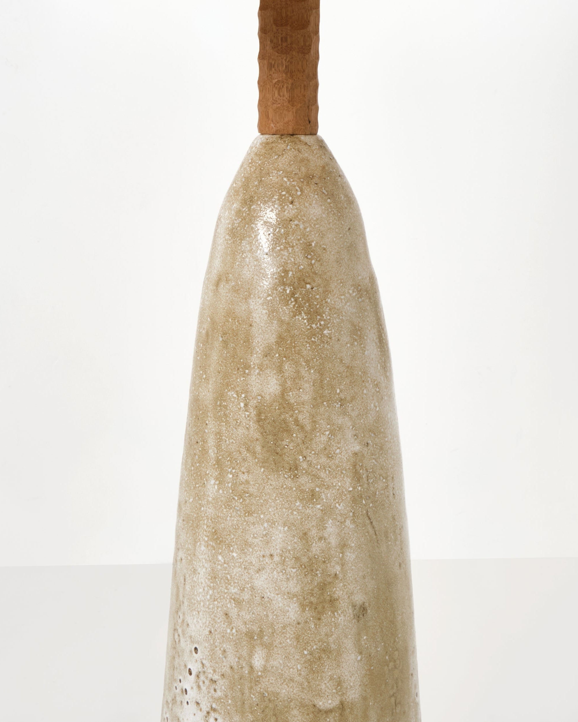 Quinta Floor Light No2 — side angle showing textured ceramic base