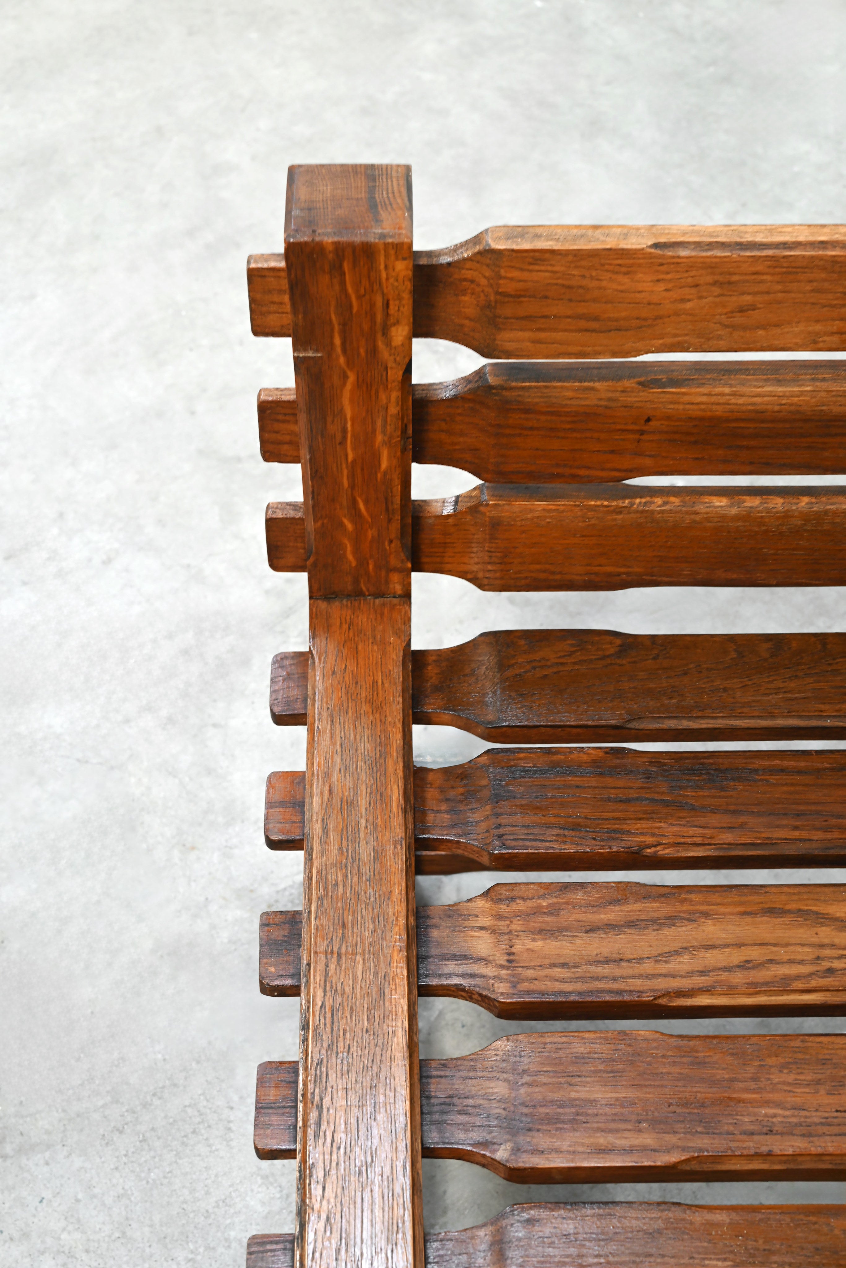 Close-up detail of solid oak joinery on 1970s brutalist chair