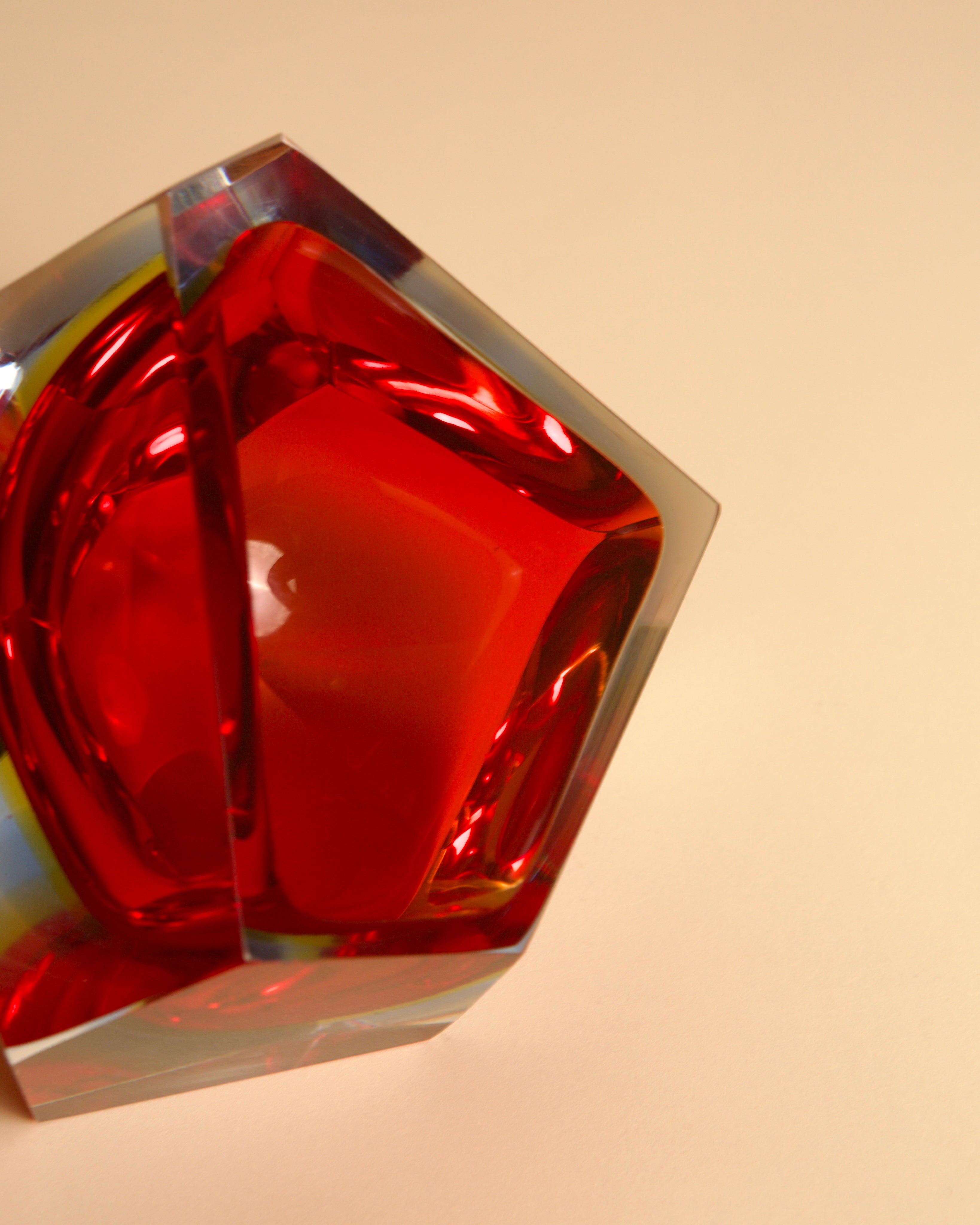 Red Murano glass vase detail showing curved sculptural form
