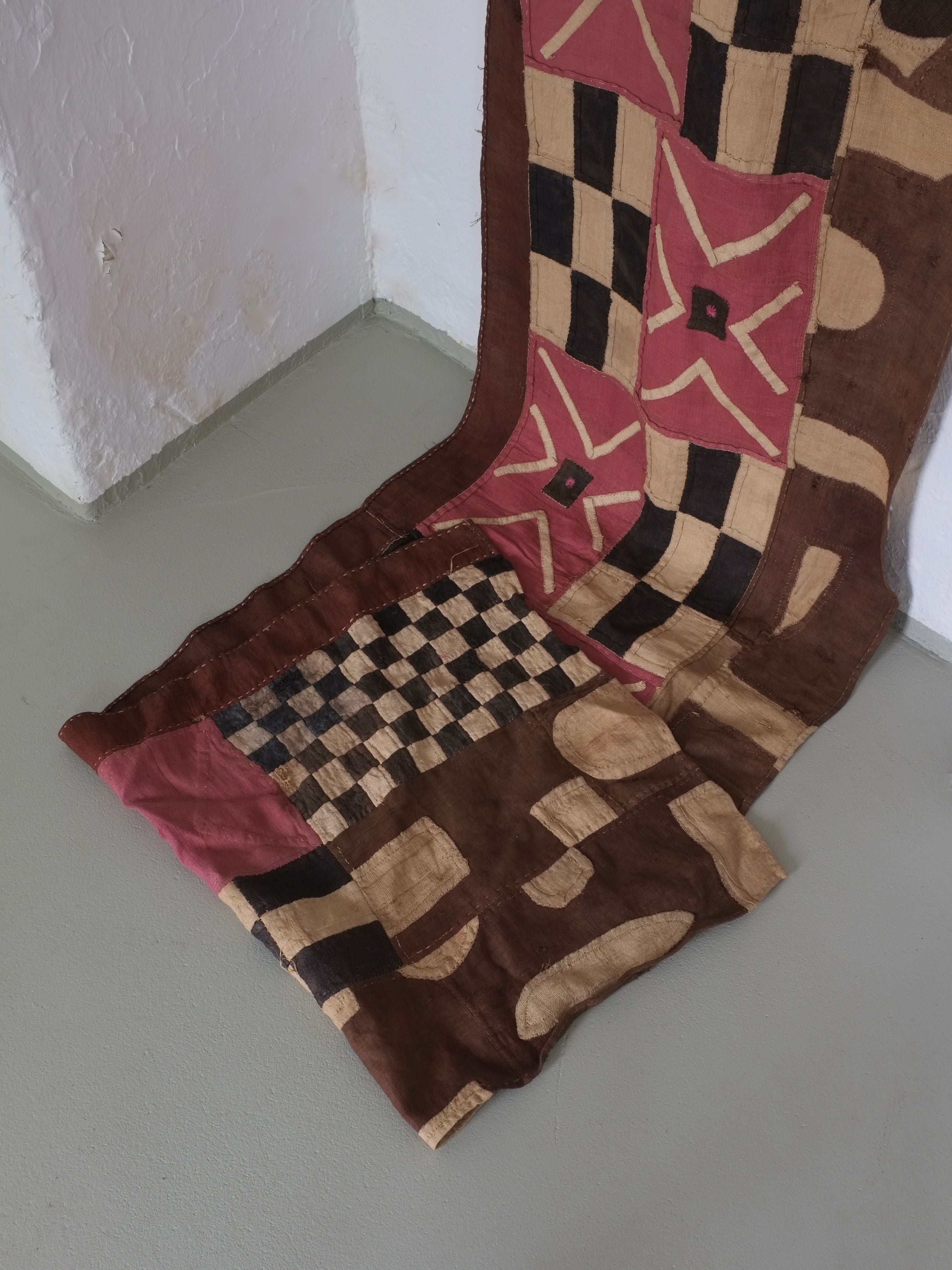 Checkered Textile Wall Hanging, Africa, Mid-Century — angled view on neutral floor