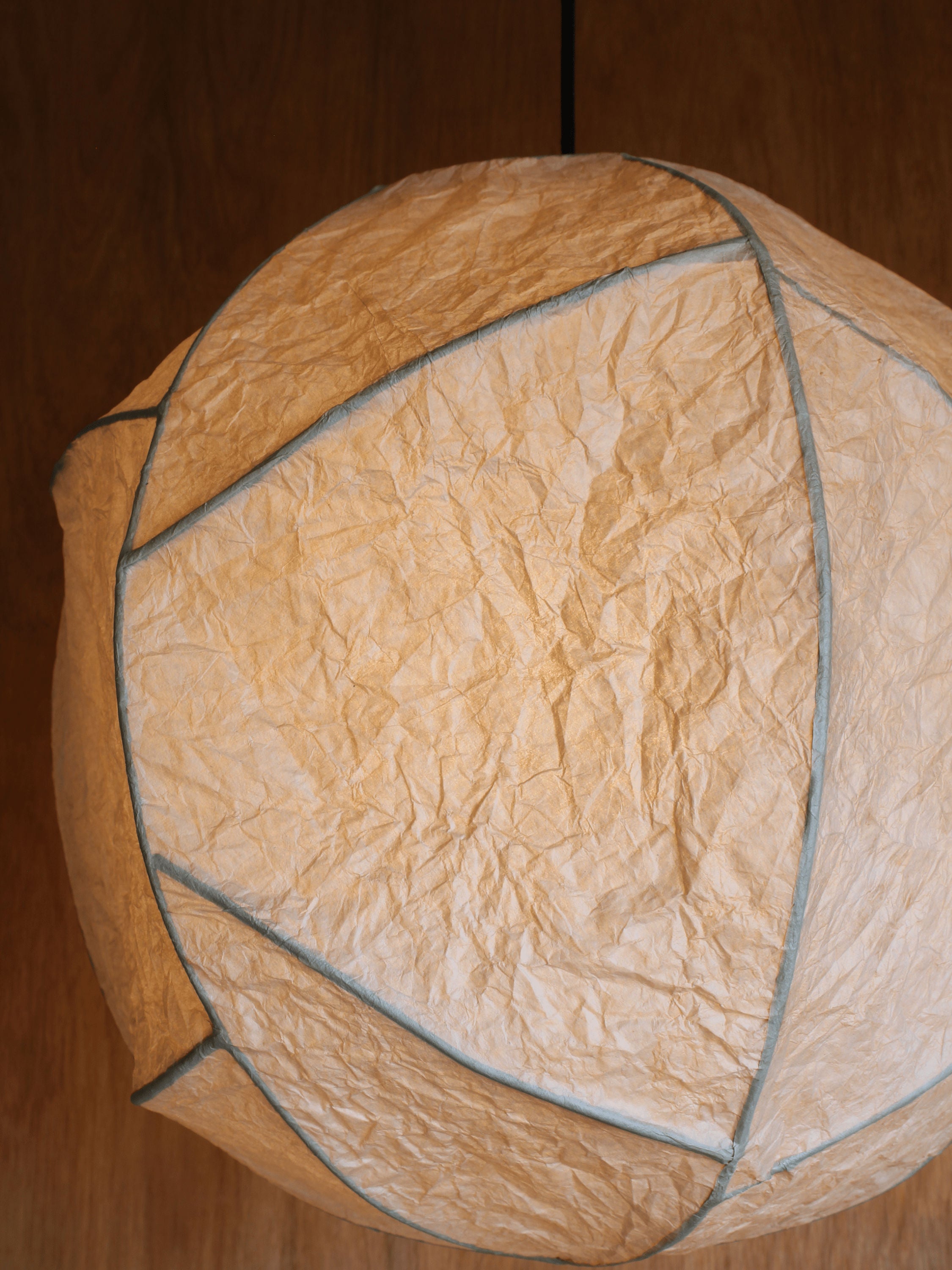 Sol' Pendant Light — overhead view highlighting textured paper material