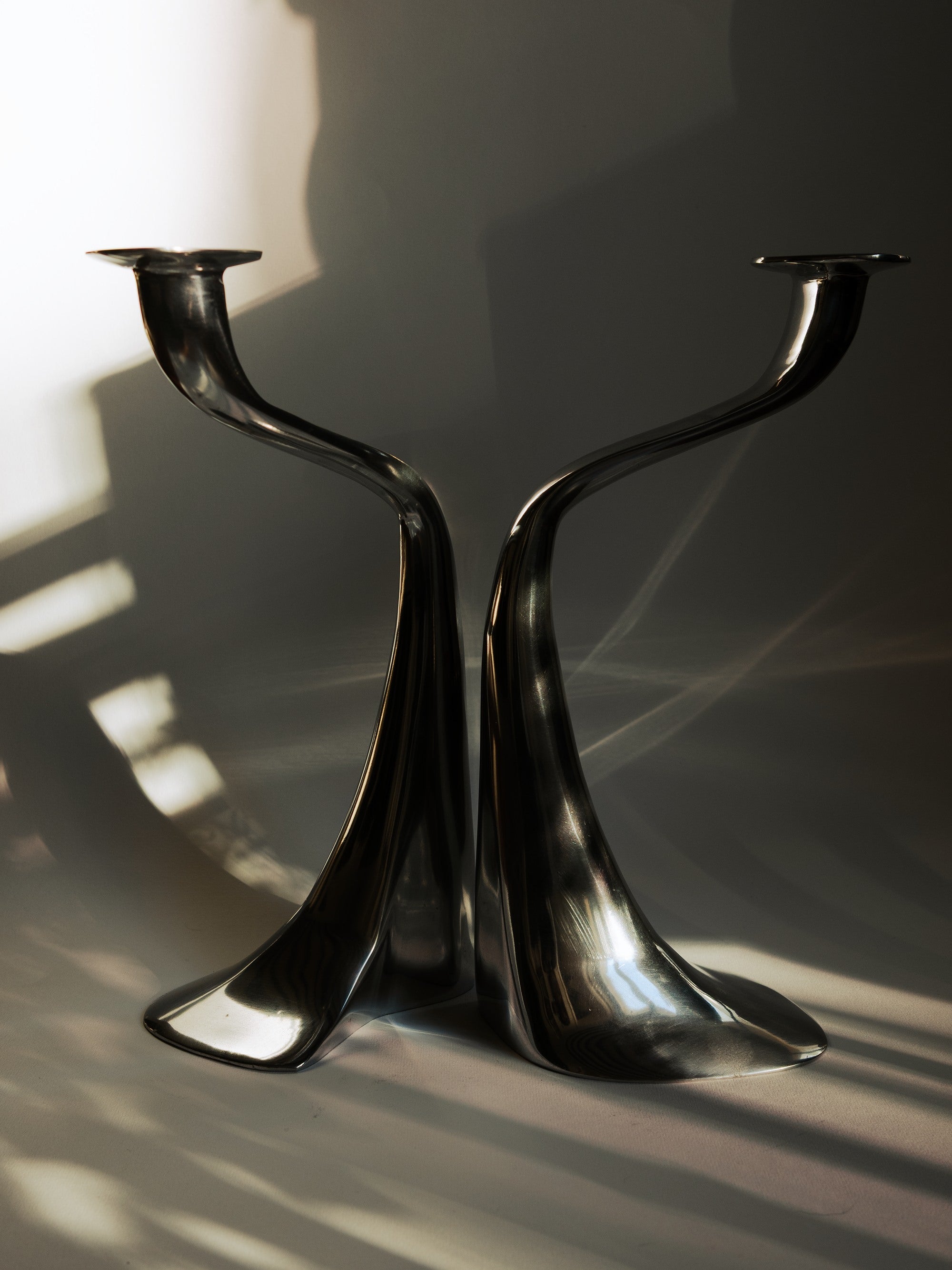 Driade Aluminium Candleholders - Italy — close-up of polished aluminium surface