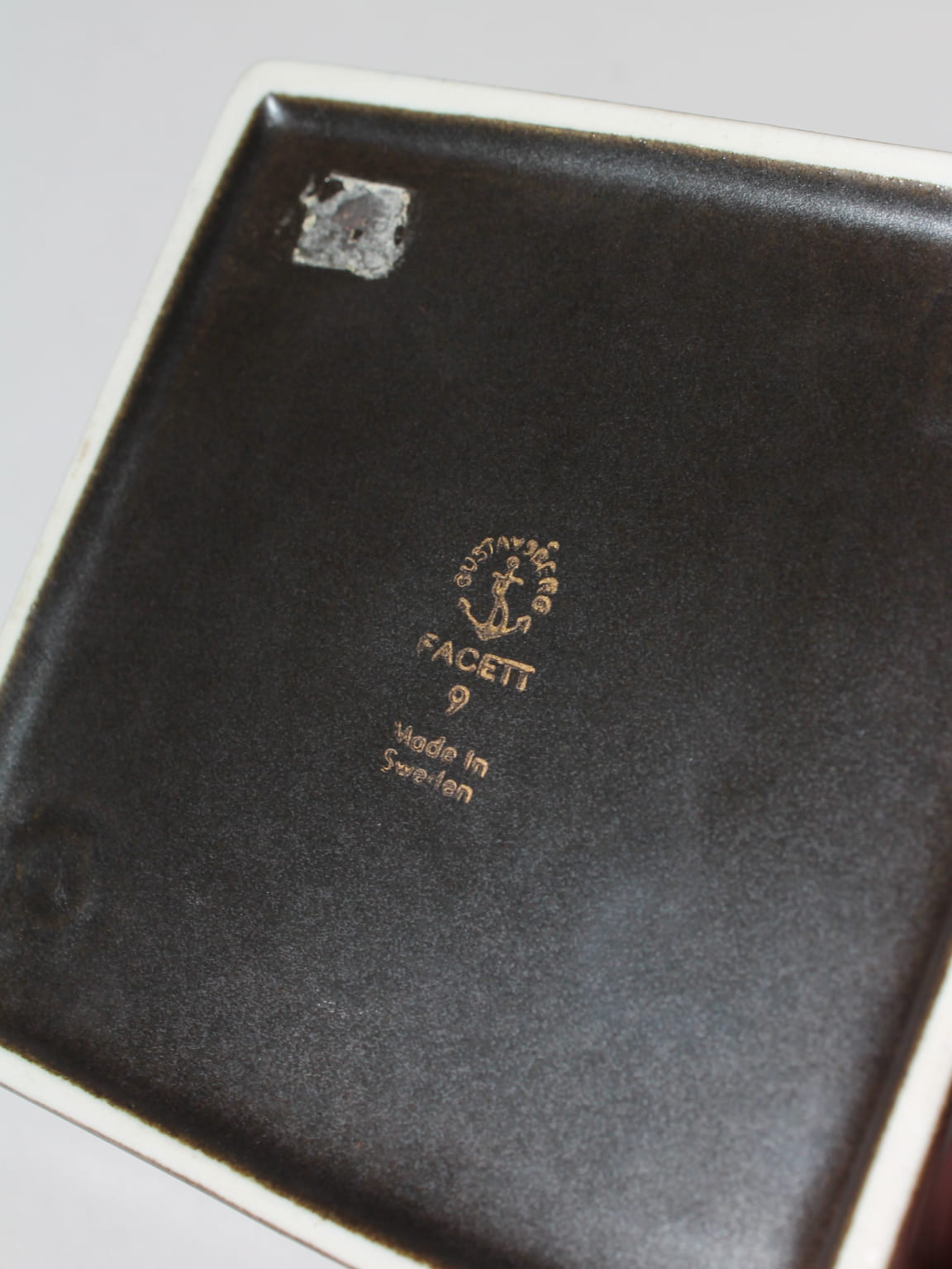 Sven Jonson "Facett" Ceramic Ashtray, For Gustavsberg, 1960s — underside view showing maker's mark and dark glaze