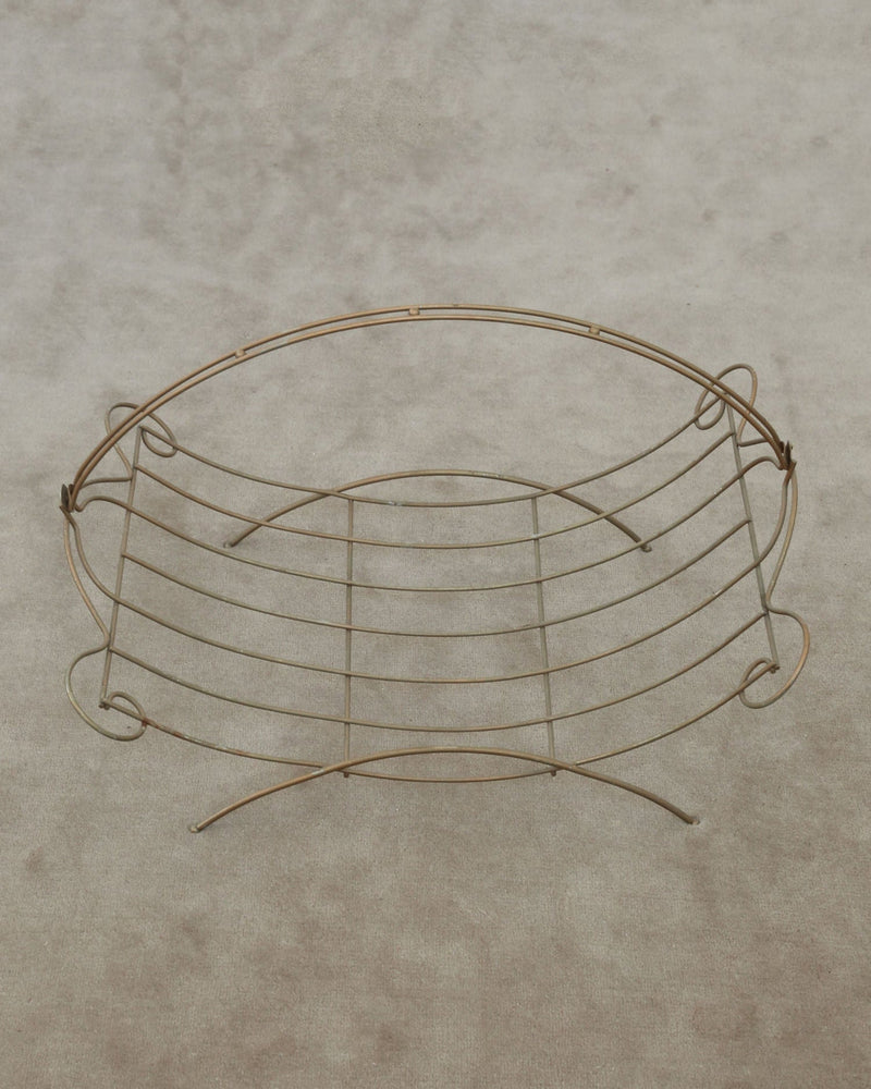 Grecian copper wire magazine rack with curved legs and handles