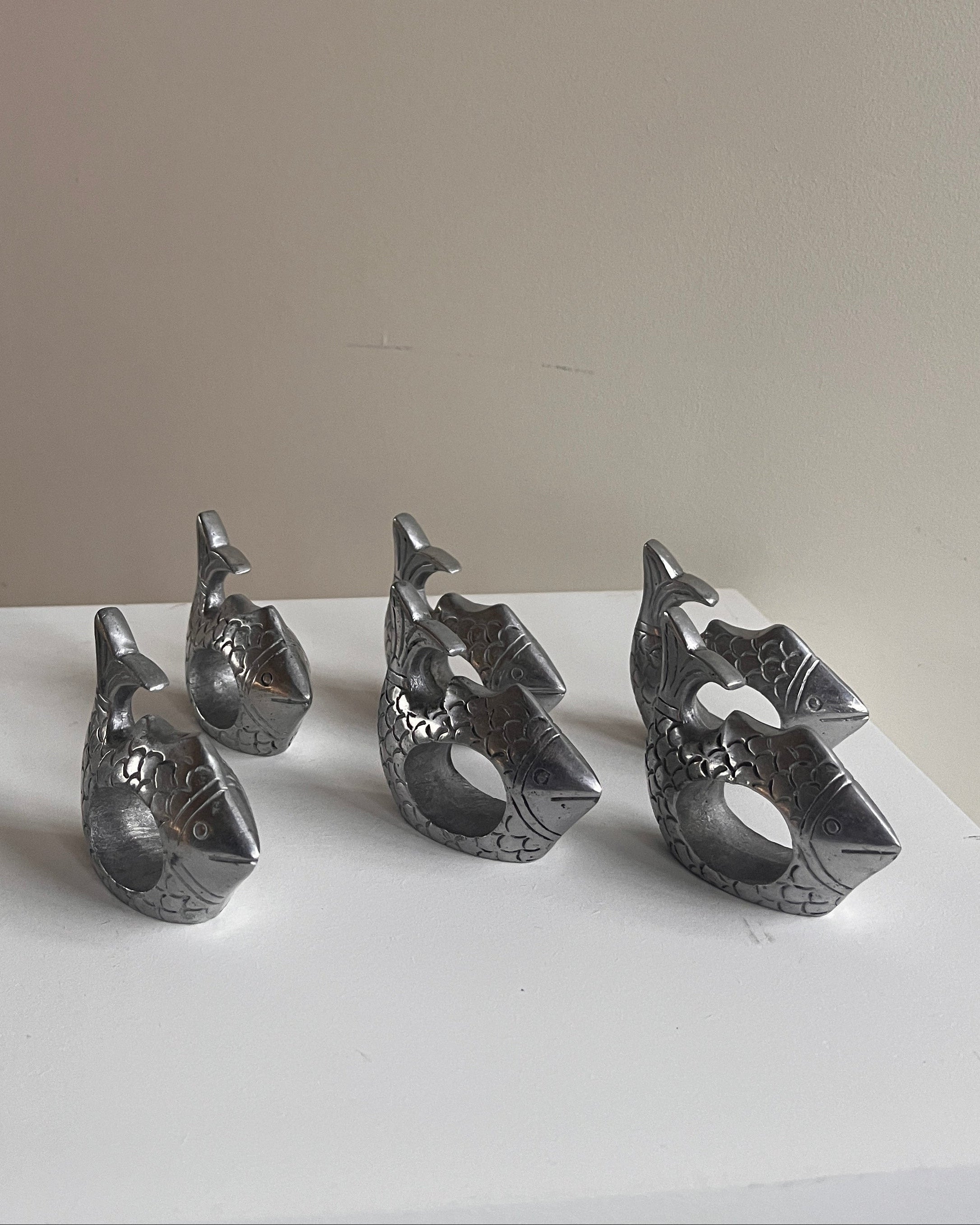 Pewter Fish Napkin Rings - Set of Six — side angle showing detailed fish design