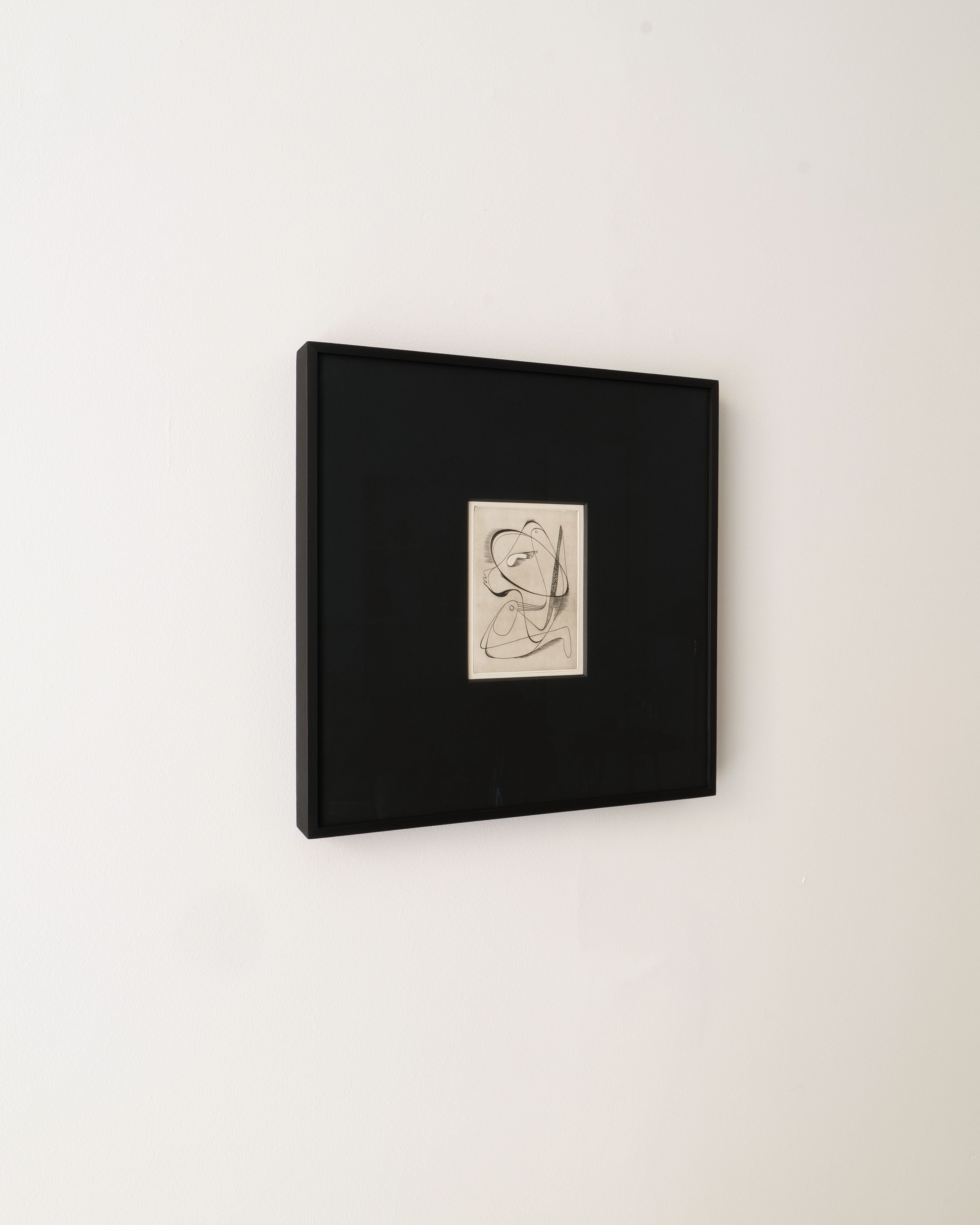 Surrealist Engraving Painting Sylvain Durand — side view in black frame on wall