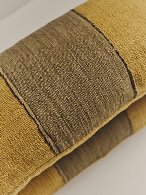 Handwoven green two-tone cushion — side angle
