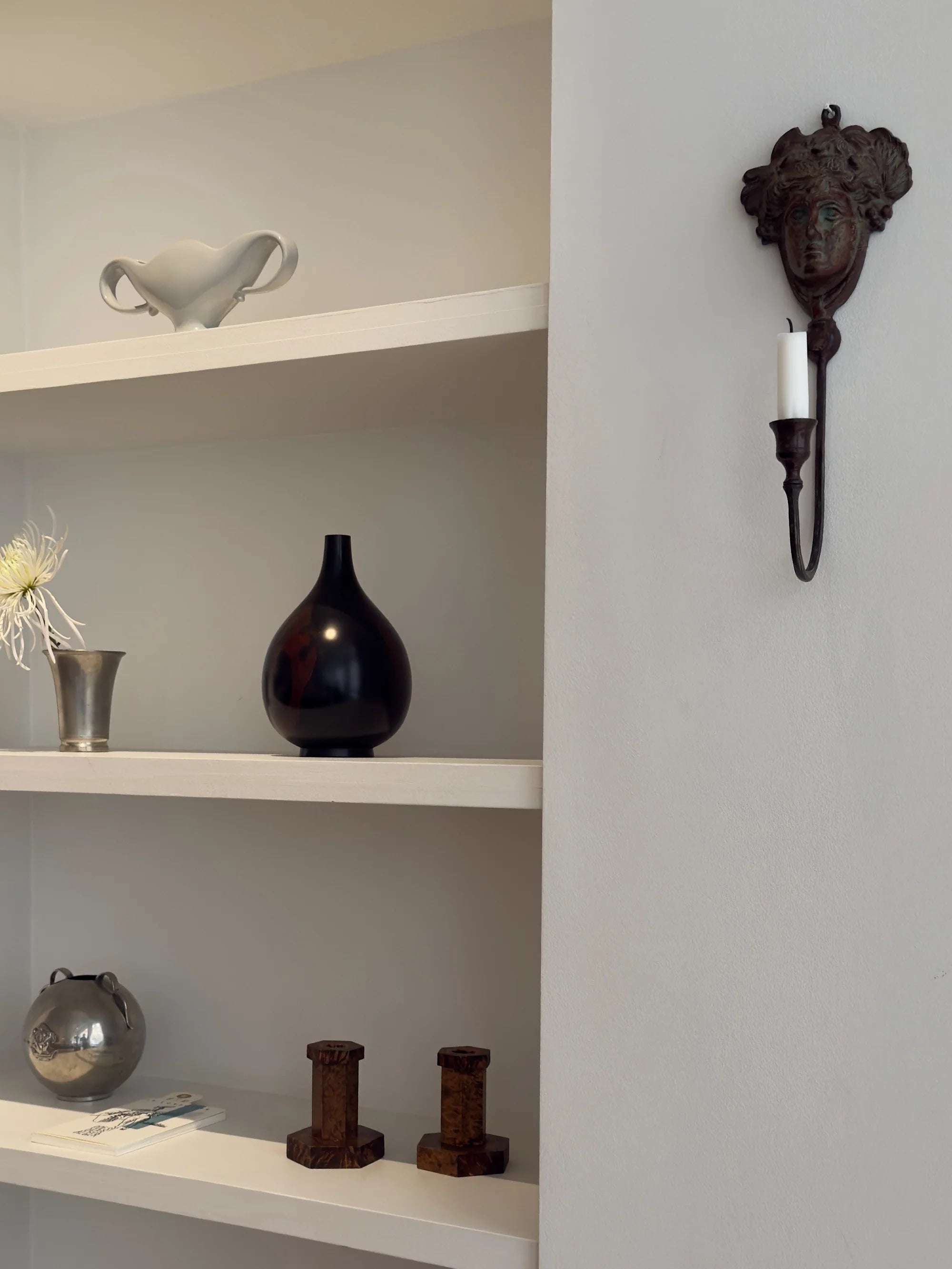 Neoclassical Bronze Candle Sconce — back view mounted on wall shelf