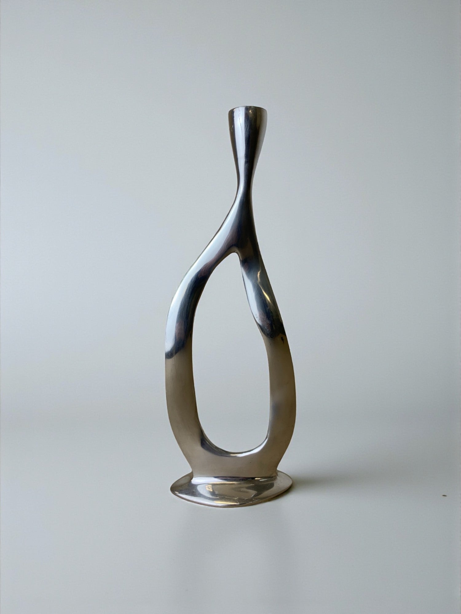 Biomorphic Candleholder, Aluminum, Spain, Circa 1970s — close-up of polished aluminum surface