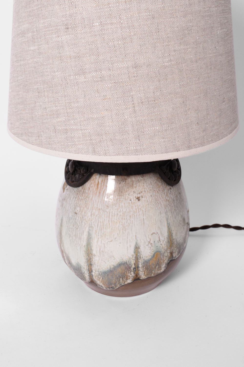 Art Deco Style Lamp in Enamelled Sandstone Keramis — close-up of lamp base with fabric shade