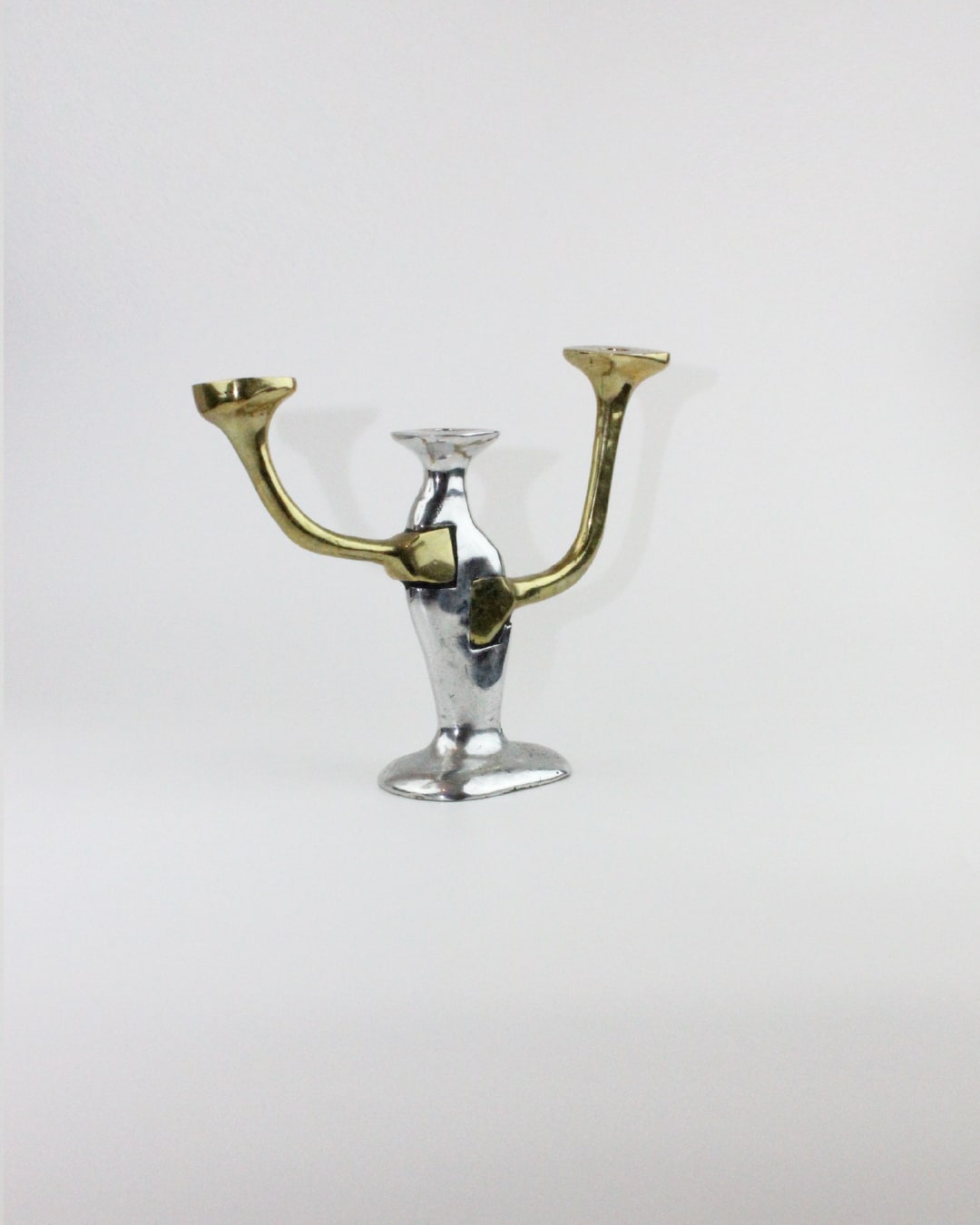 Brutalist Candleholder — side view highlighting metallic finish and design