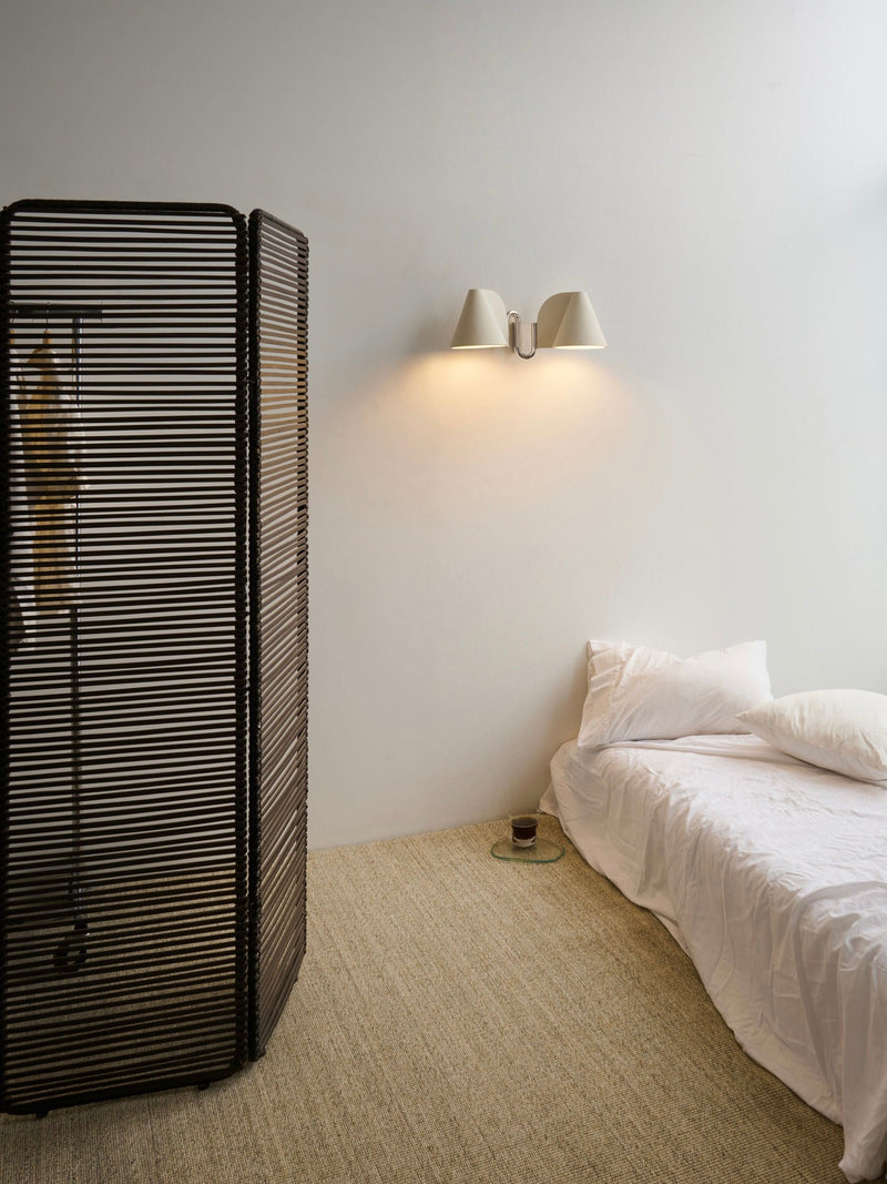 Synapse Wall Light — mounted on wall beside bed in modern setting