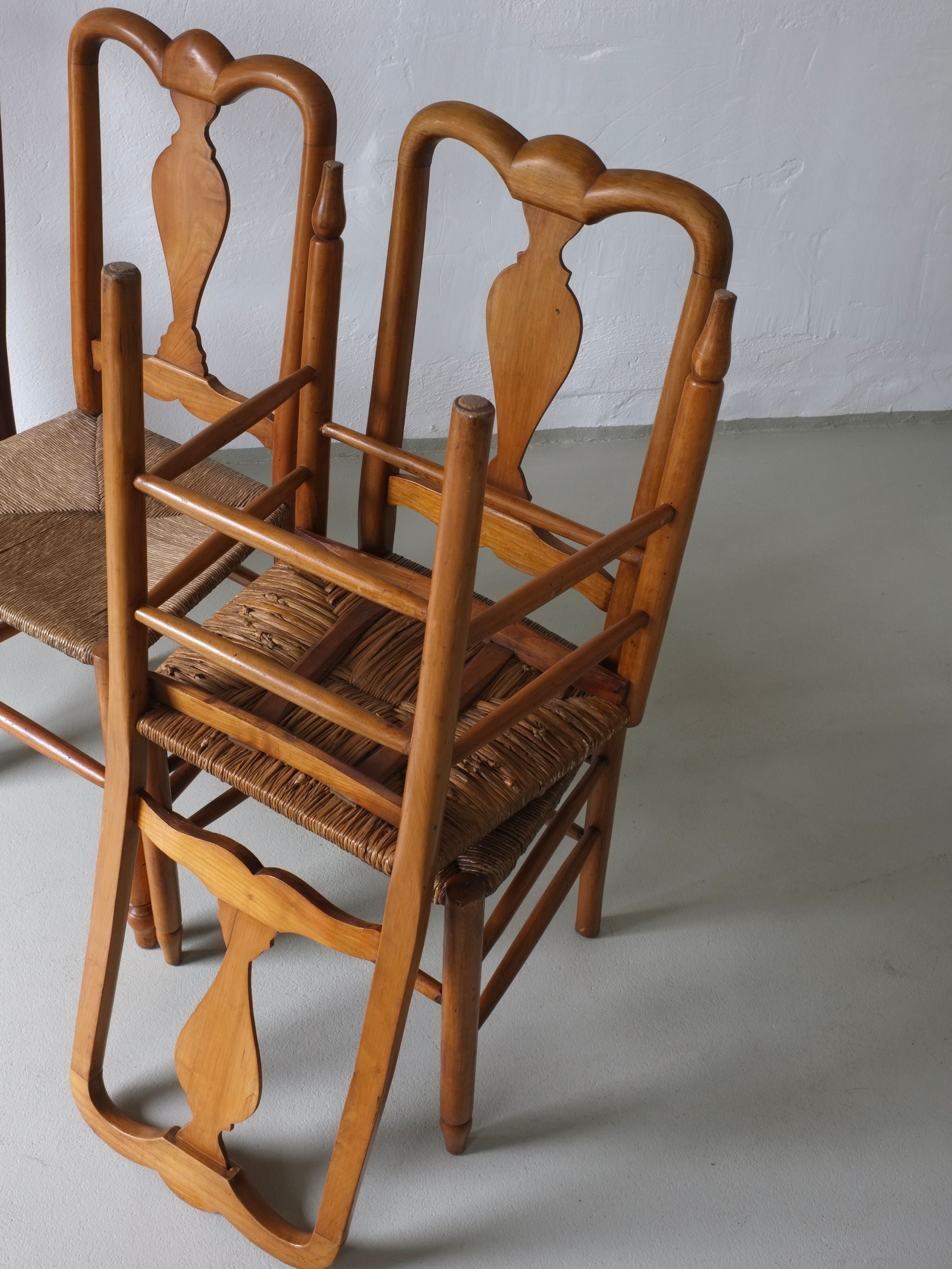 Rustic Rush Seat Chairs, Belgium 1940s — stacked wooden chairs on light floor