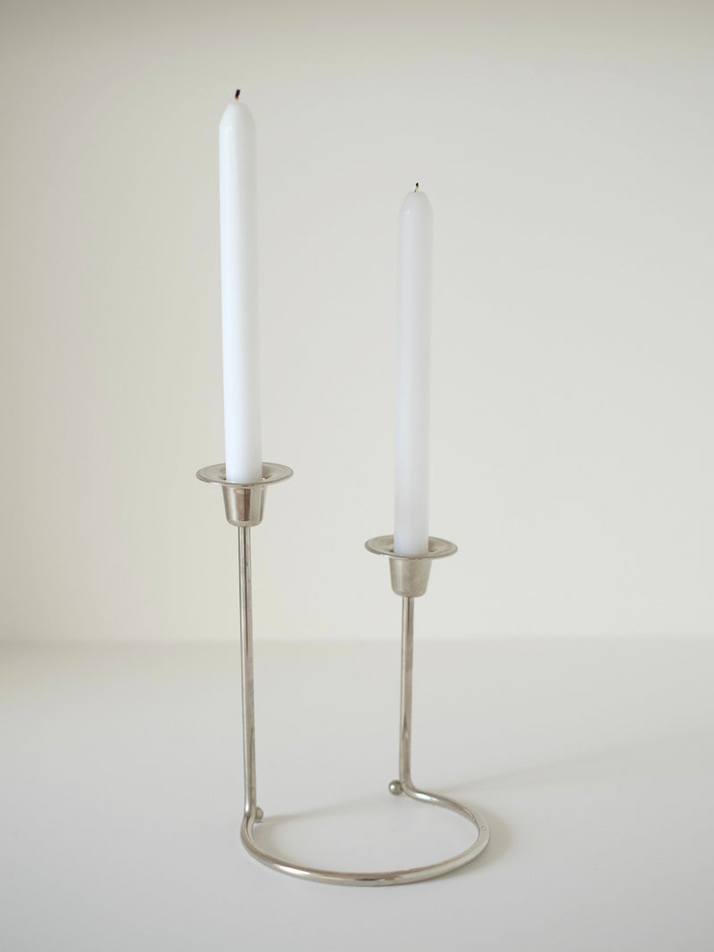 WMF Candle Holder — close-up of polished metal with white candles