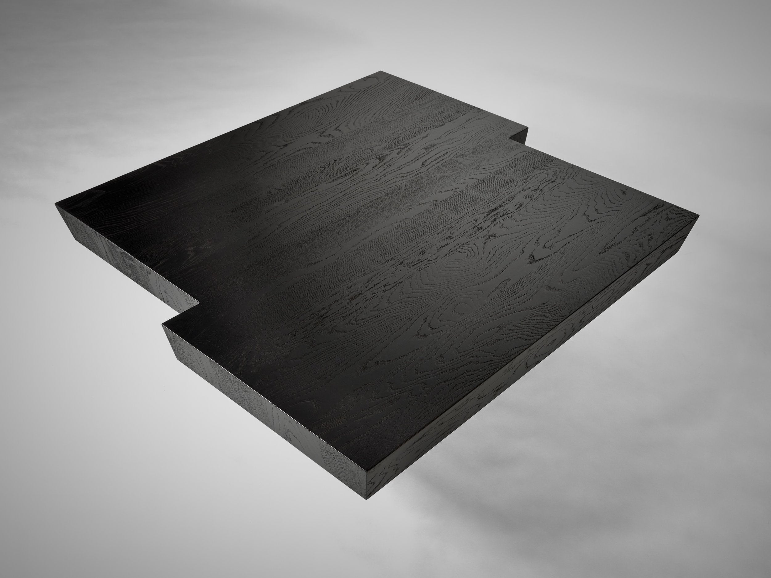 Taes Coffee Table — top view of black wood surface
