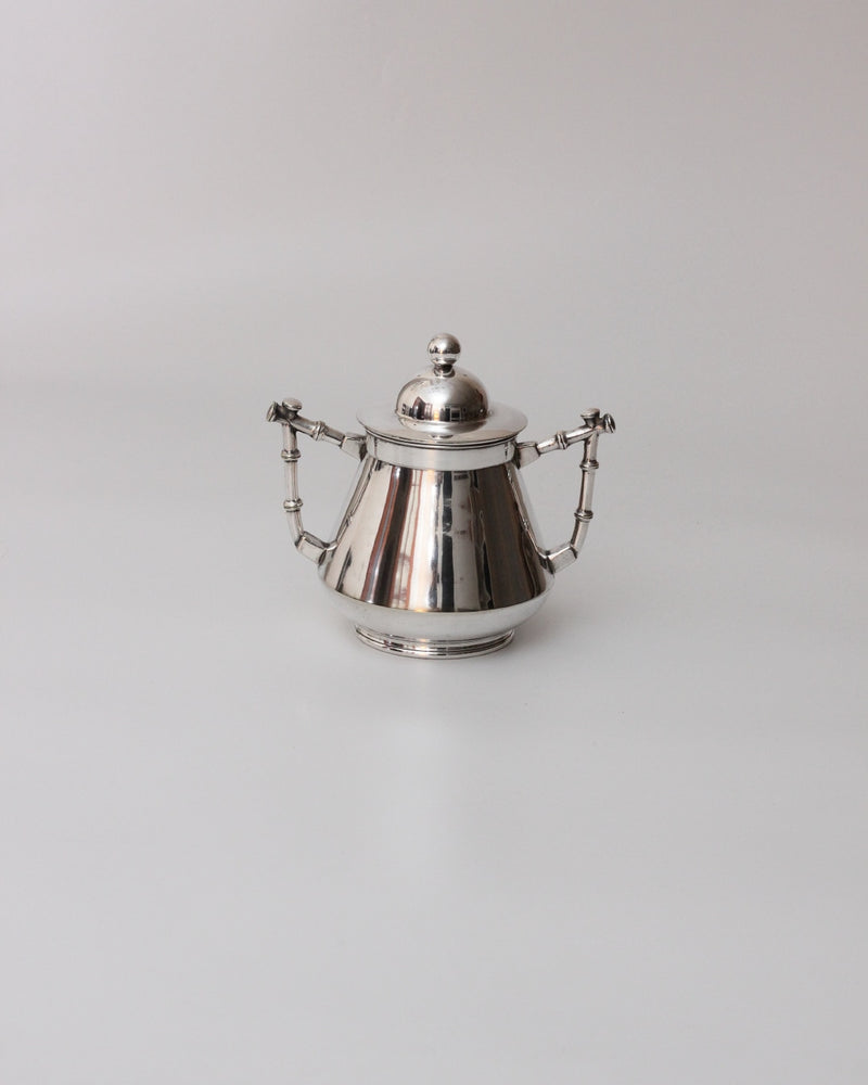 Art Deco Coffee Set — close-up of polished silver teapot