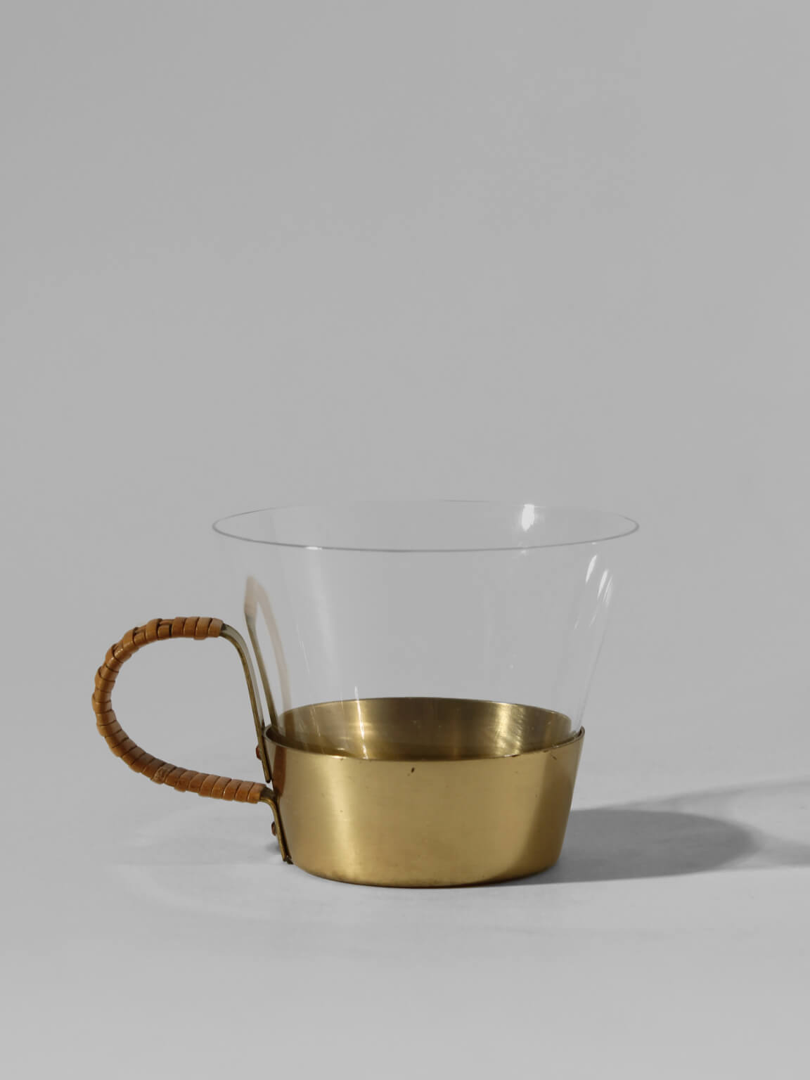 Albert Gustav Bunge Coffee Cups Set — close-up of brass base with clear glass
