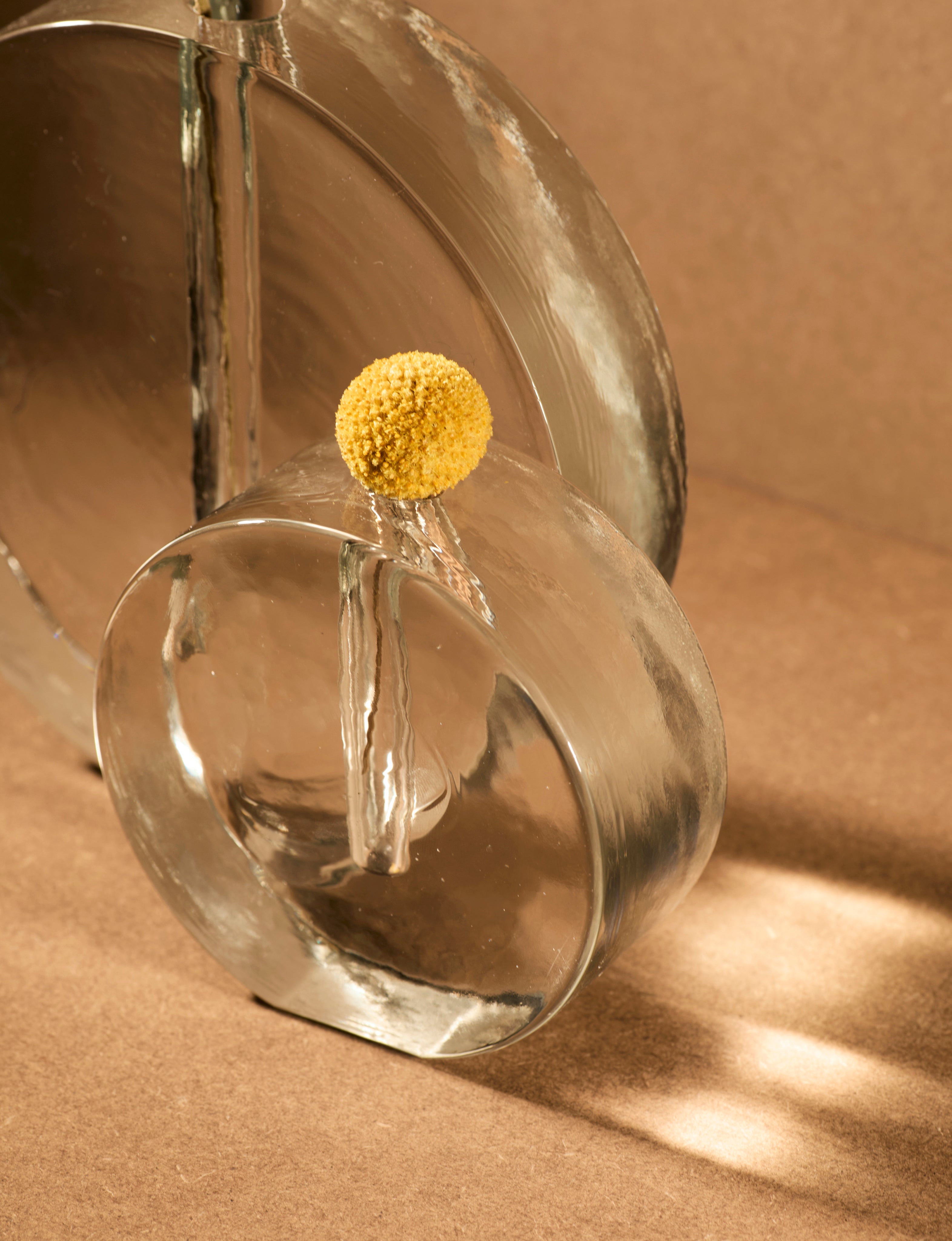 Vintage Scandinavian Clear Vase in Glass — angled view on brown backdrop