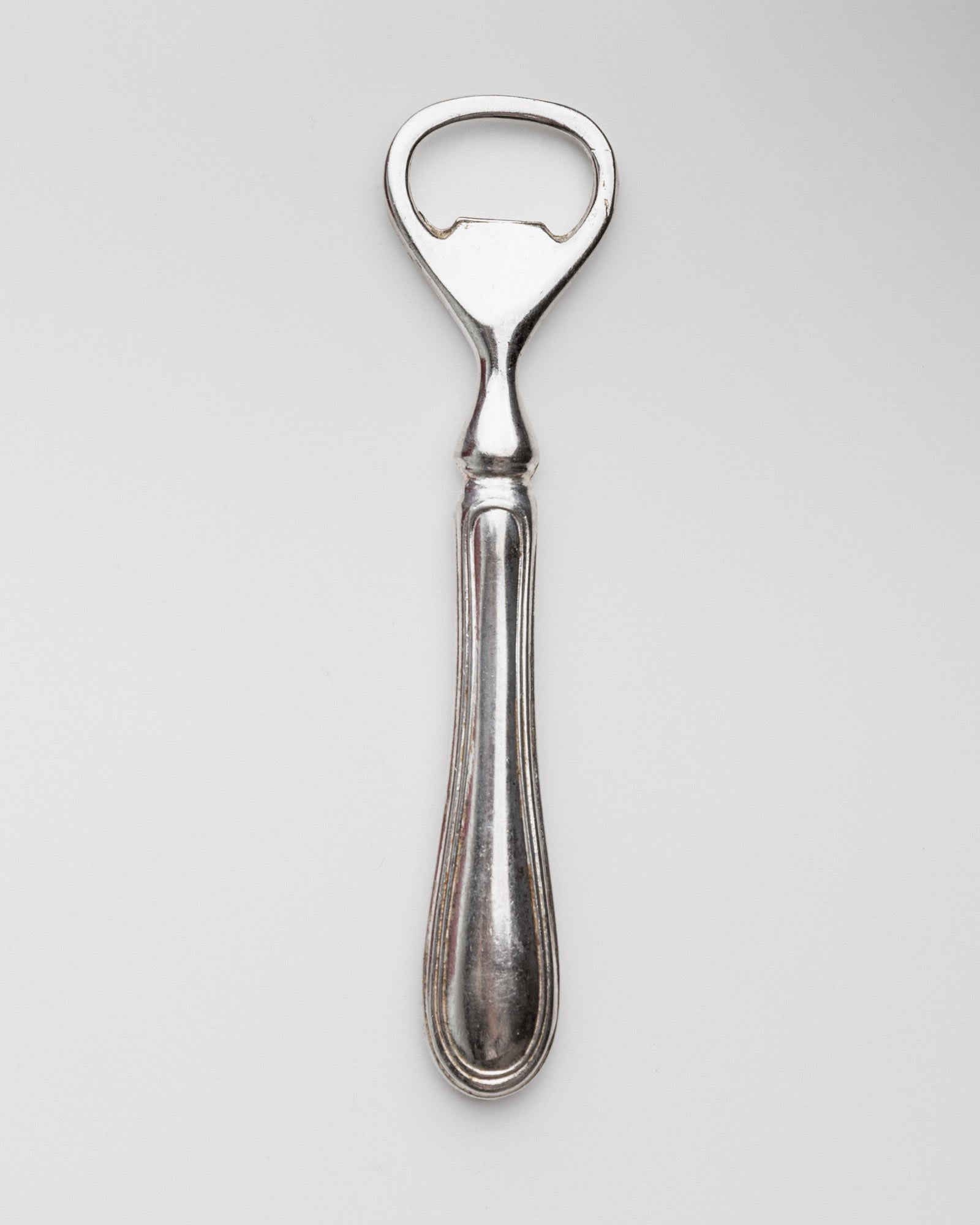 Vintage 1960s Silver Plated Bottle Opener, Classic Minimal Design — top view on white background