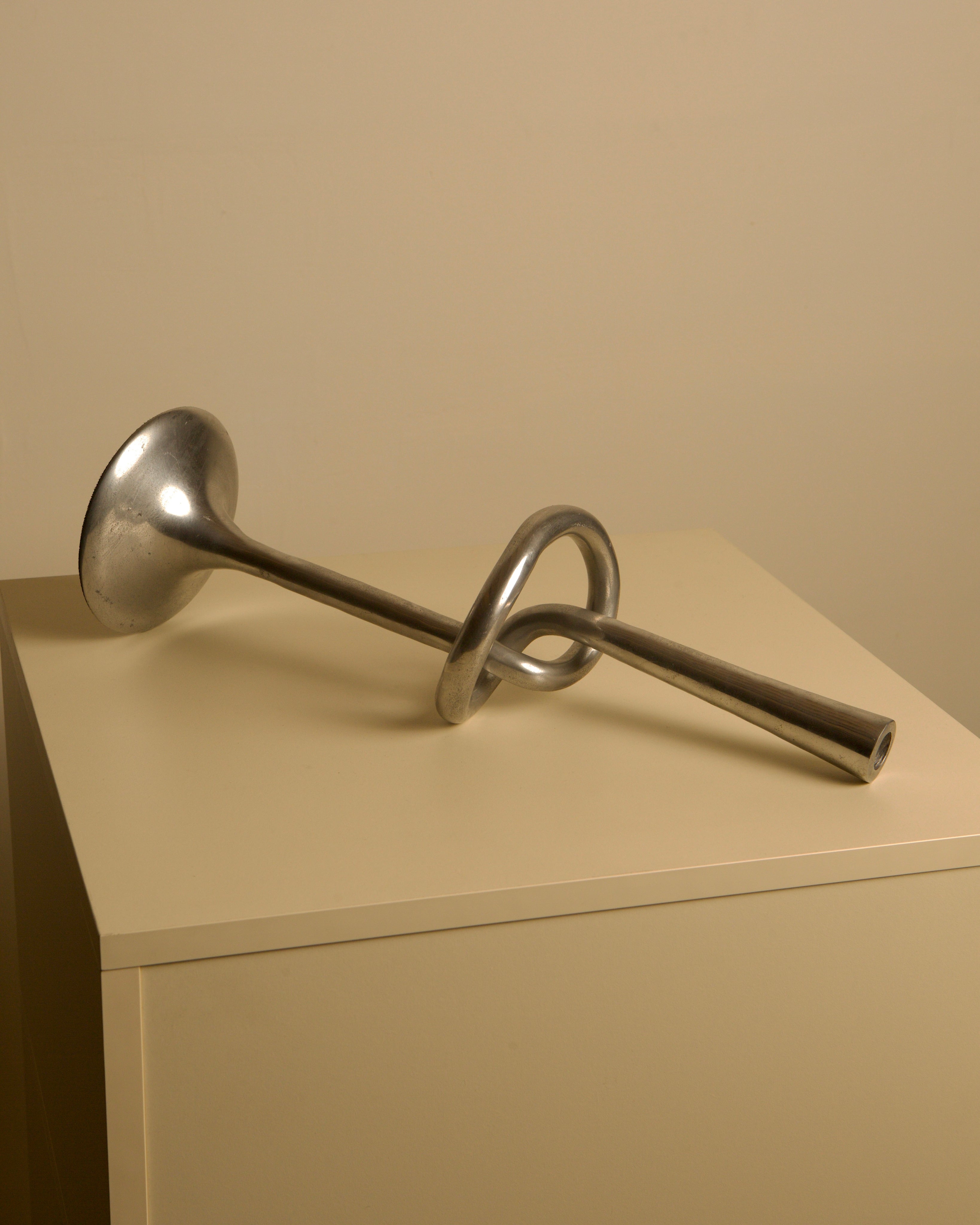 80s Aluminum "Knot" Candleholder — angled view on neutral surface