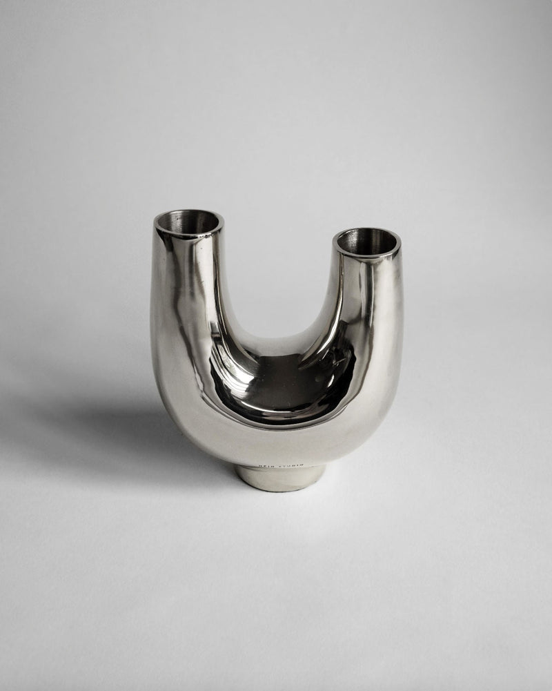 Kazumi Vase - Titanium — close-up of reflective titanium surface