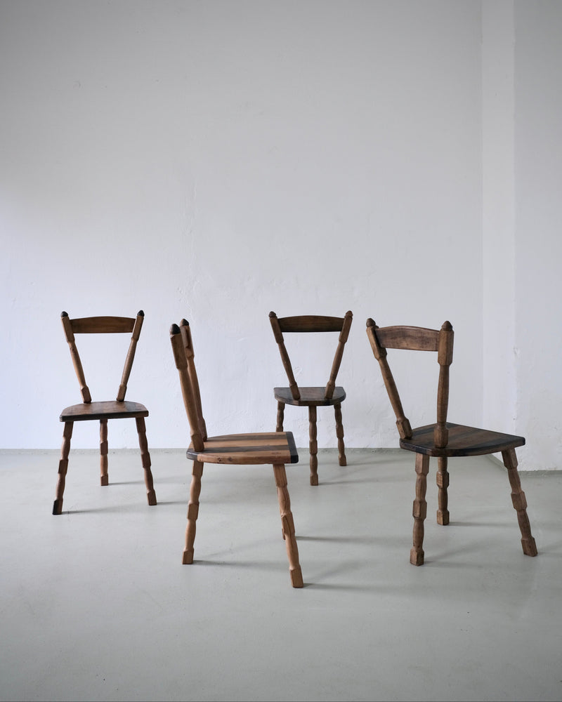 Set of four brutalist wooden dining chairs with tripod legs, 1970s